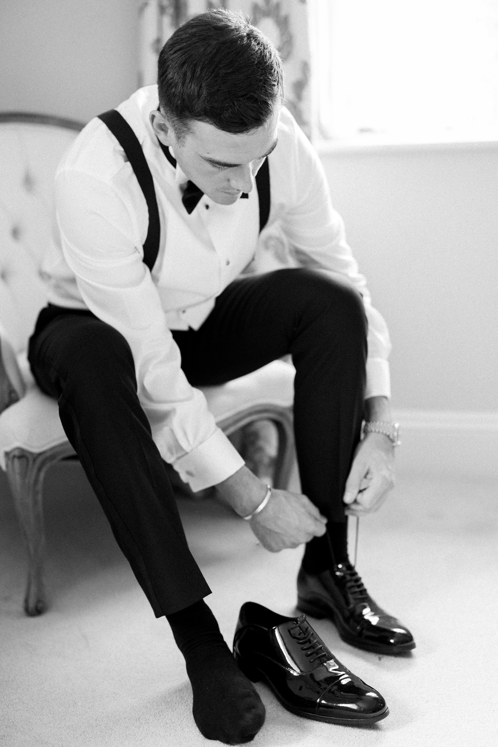 Groom getting ready for luxury wedding at Somerley House