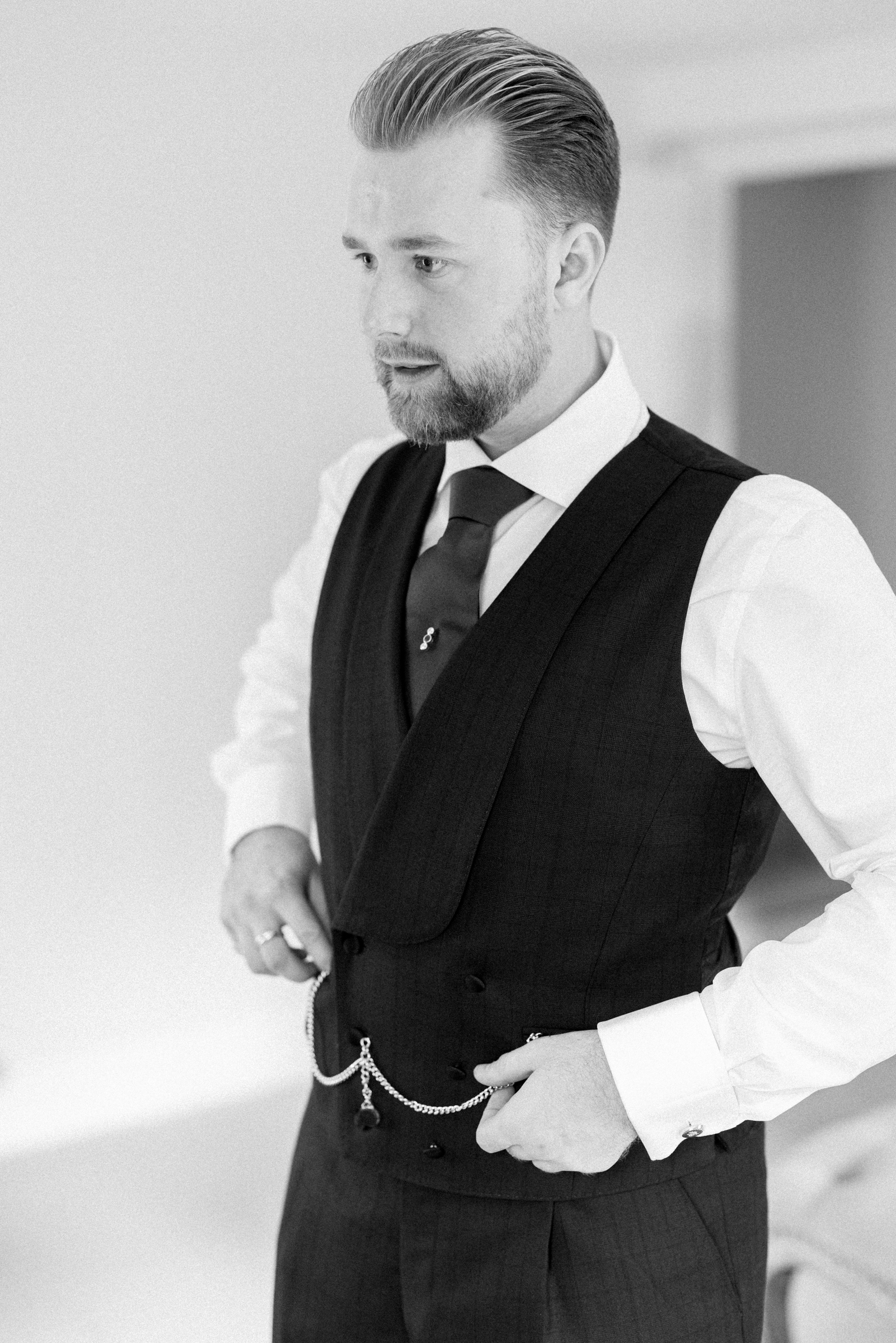 Groom getting ready for luxury wedding at Somerley House