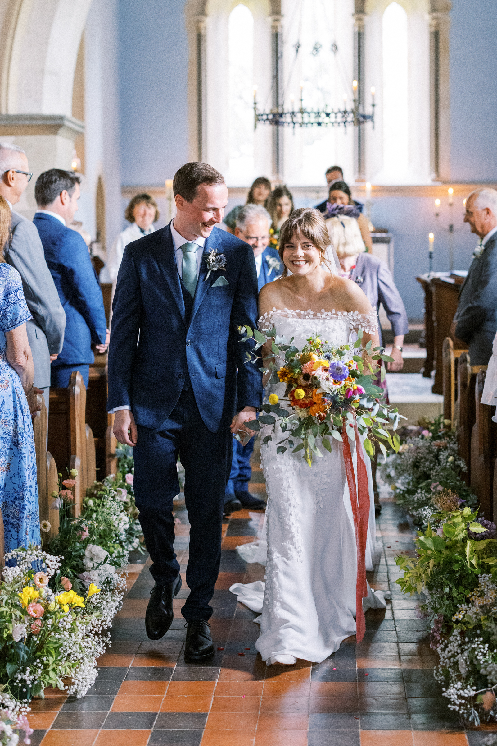 Bride & Groom leave South Stoke Barn Wedding Church after getting married