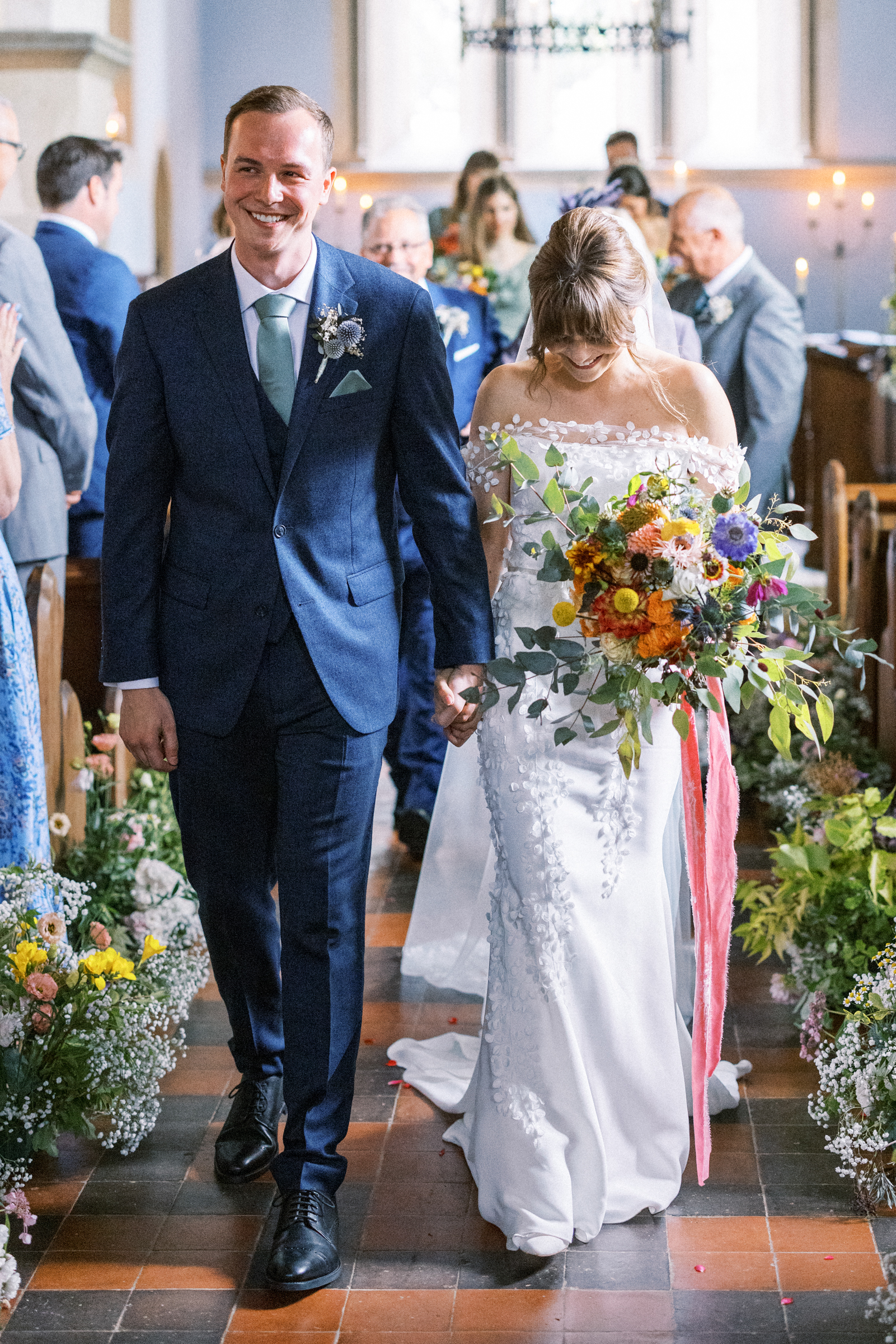 Bride & Groom leave South Stoke Barn Wedding Church after getting married