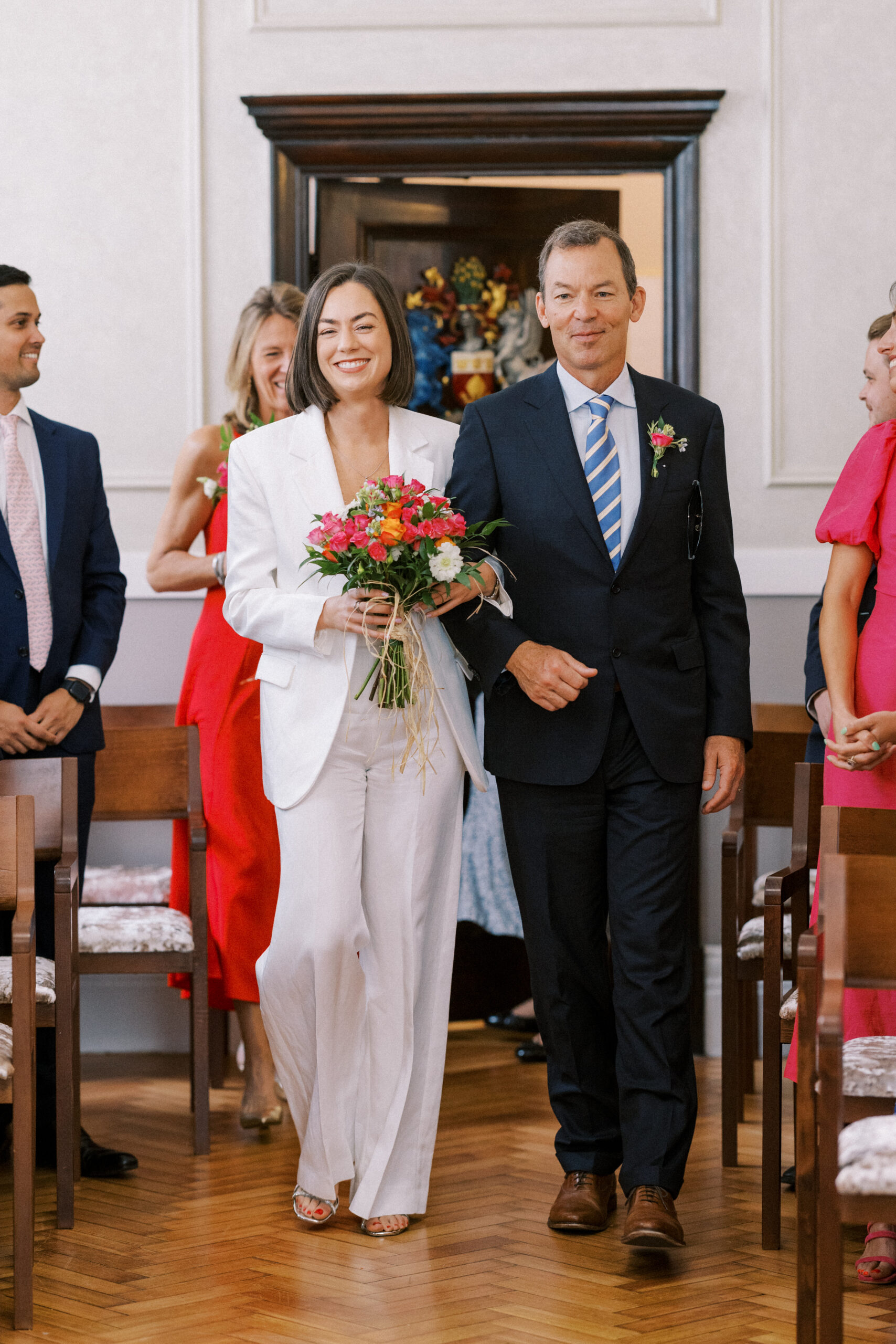 Bride walks down the aisle at her Chelsea Old Town Hall wedding.