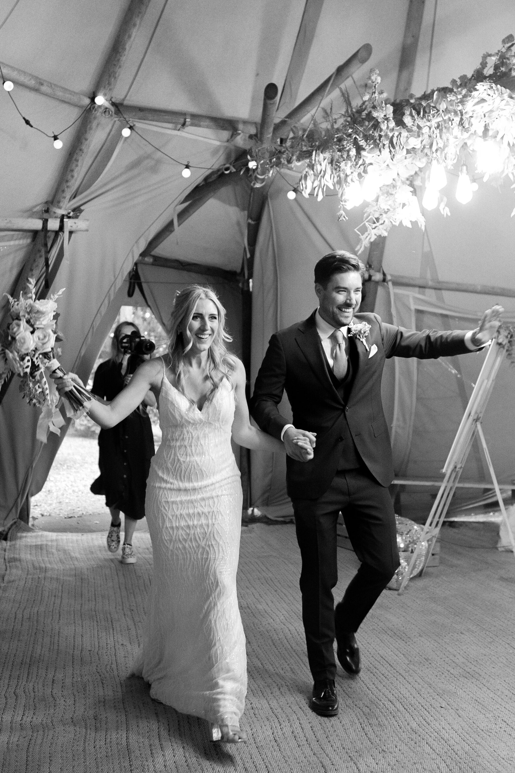 Couple enter the tent at Wilderness Wedding Venue on their wedding day