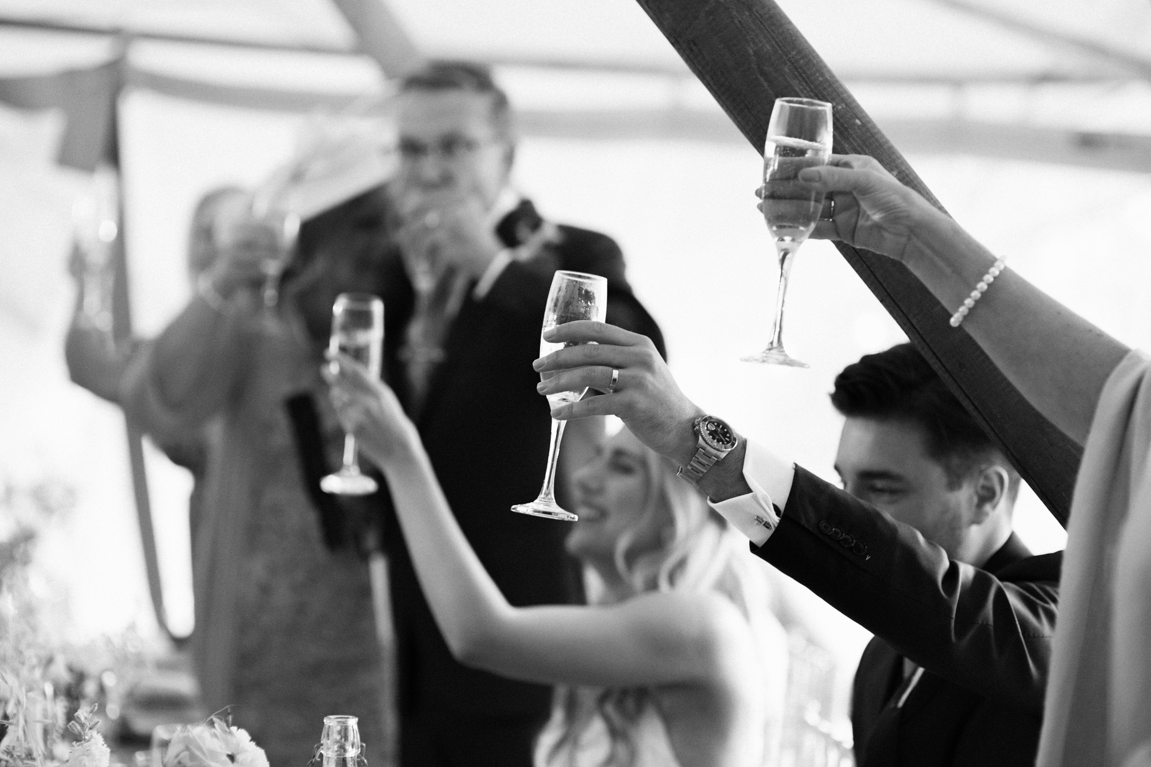 Bride and groom cheers their drinks at festival themed wedding in Kent