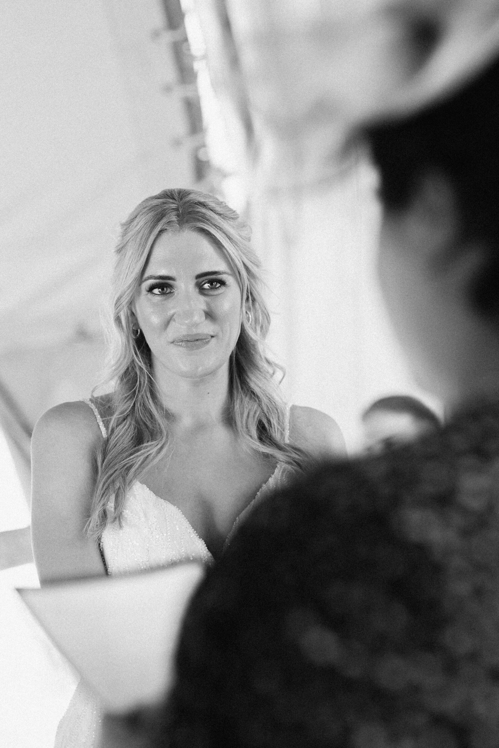 Bride listening to a reading on her wedding day at Wilderness Weddings Wedding Venue in Kent