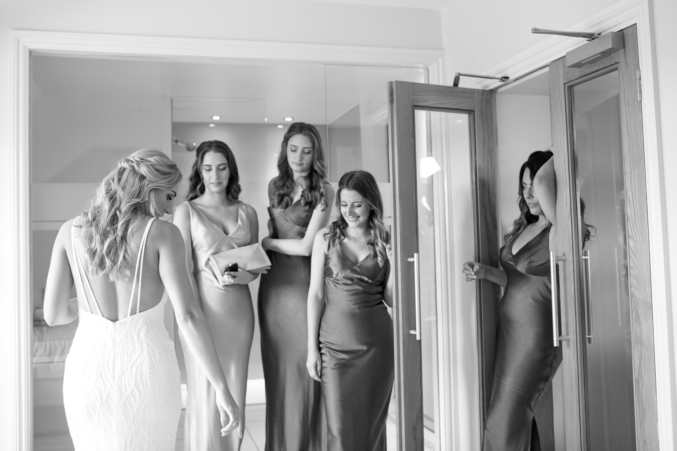 Bride and her bridesmaids getting ready for her wedding at Wilderness Weddings in Kent