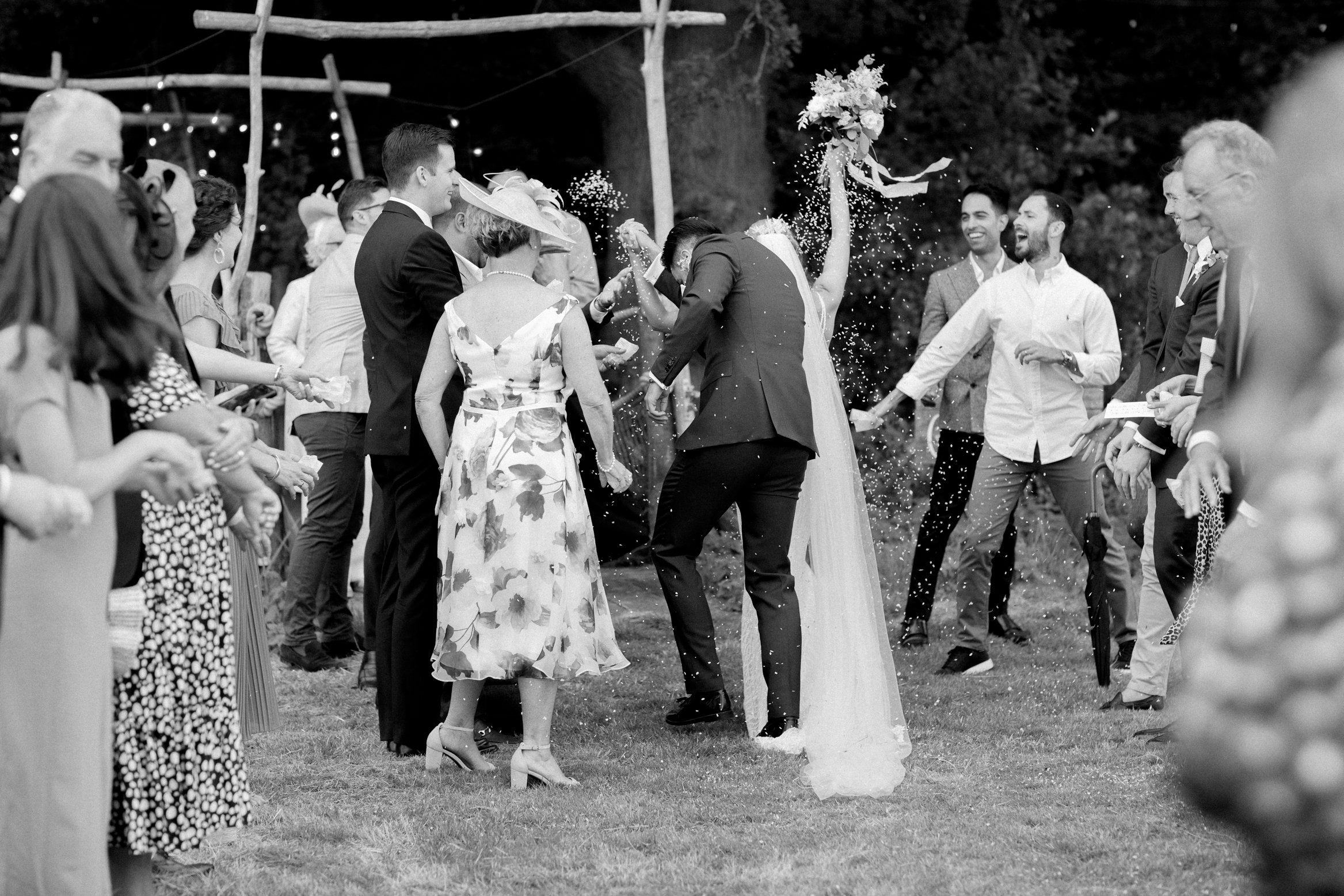 Documentary Kent Wedding Photography of a bride and groom and some confetti at their festival themed wedding at Wilderness Weddings in Kent