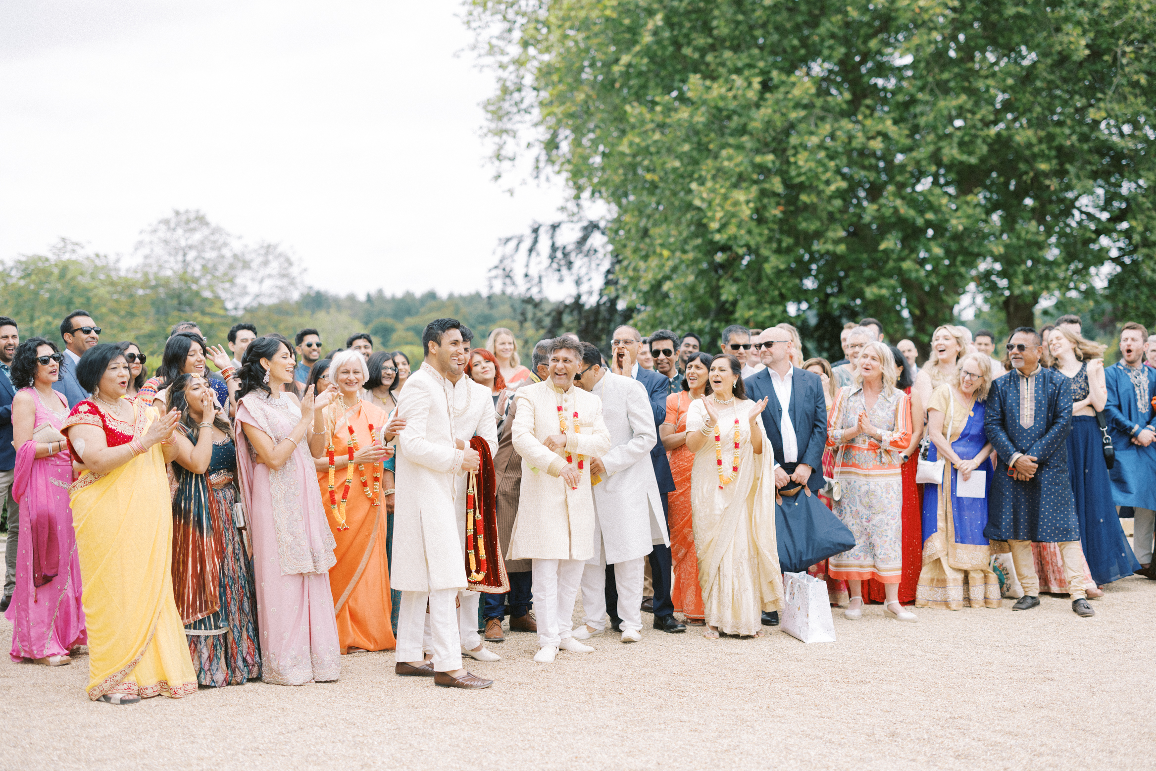 Crowd cheering at Indian wedding at Hedsor House