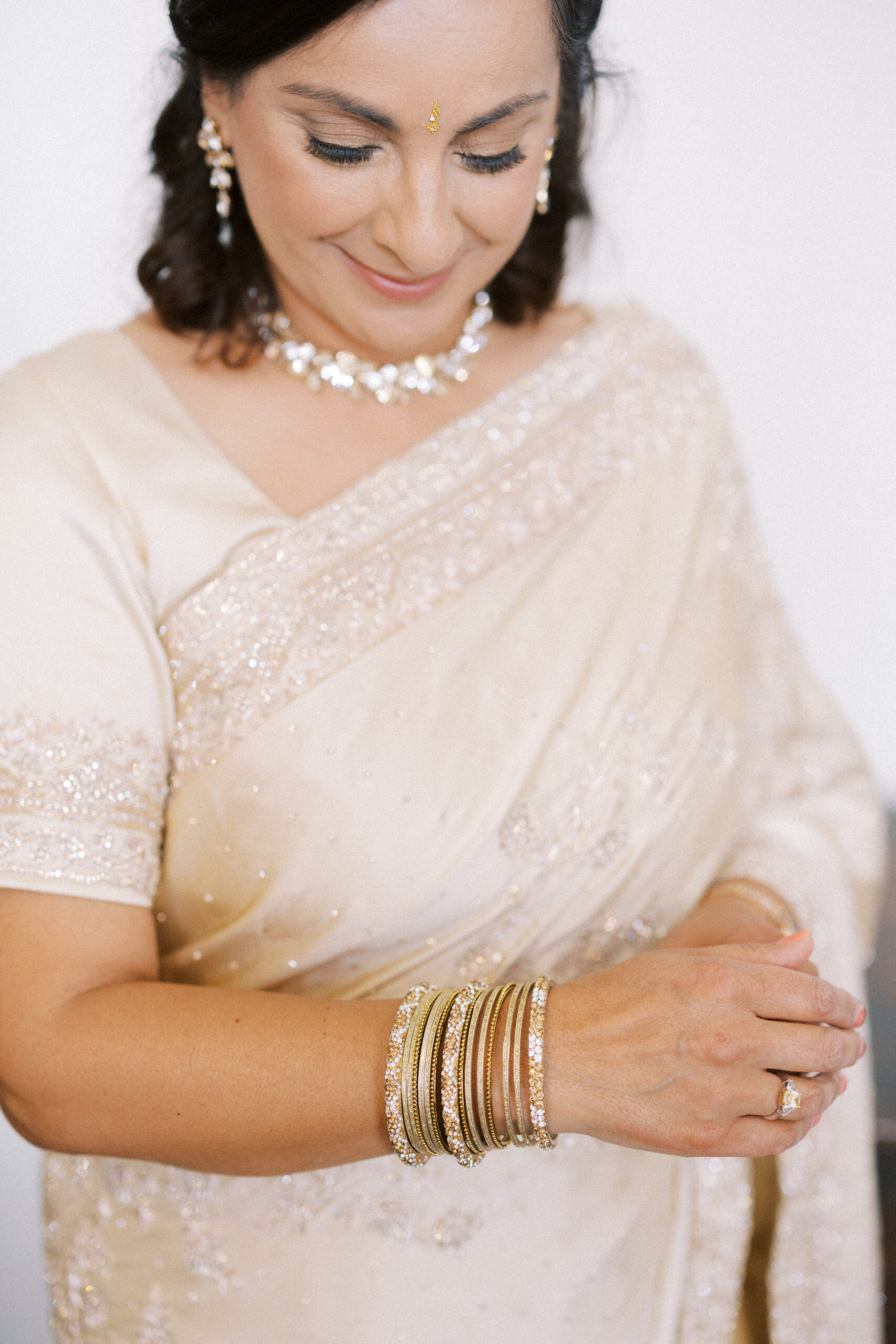 Grooms mother getting ready for Indian wedding