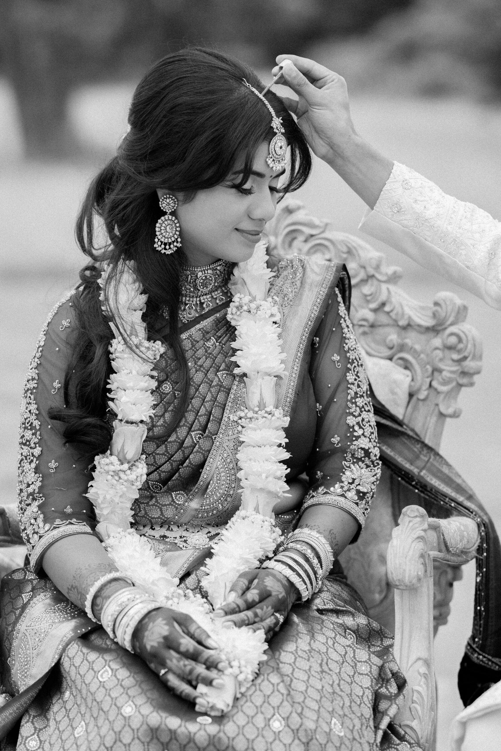 Groom performs indian ritual during wedding service