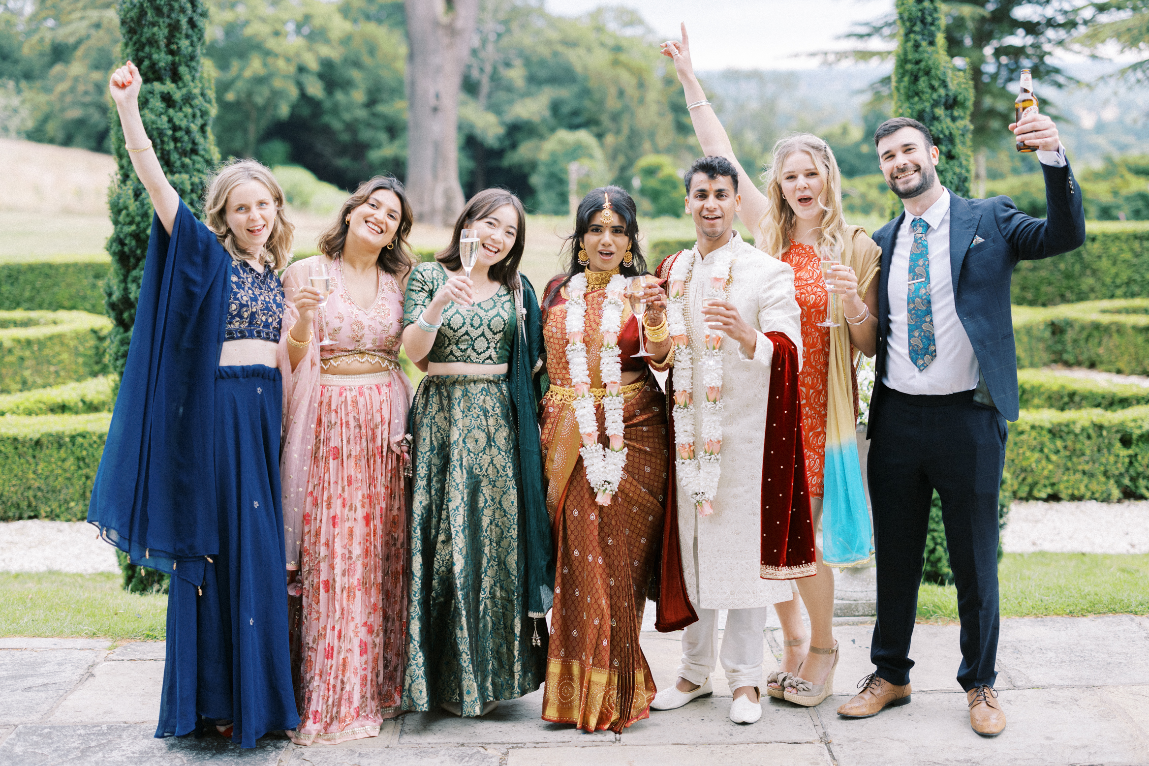 Guests chat Indian wedding at Hedsor House