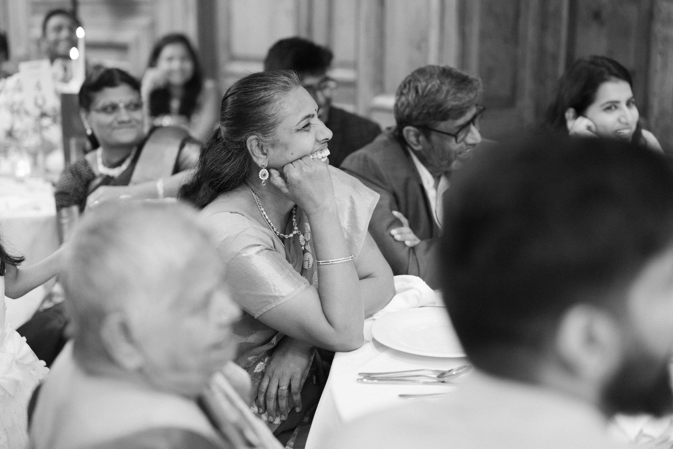 Documentary style wedding photograph of wedding guest during the speeches