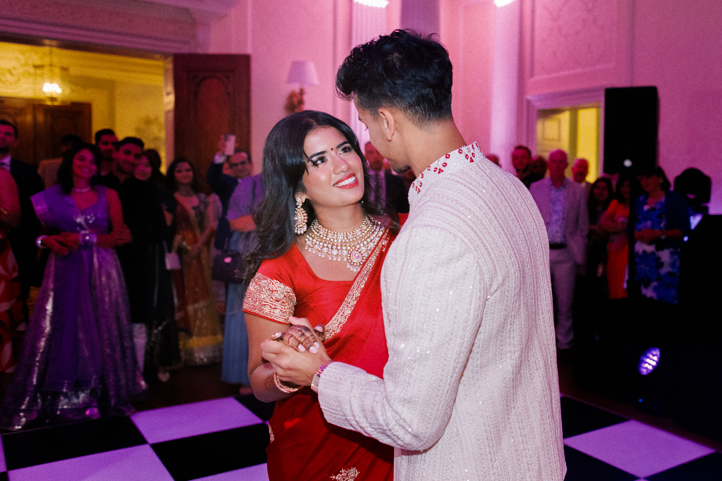 Bride and groom embrace on the dance floor