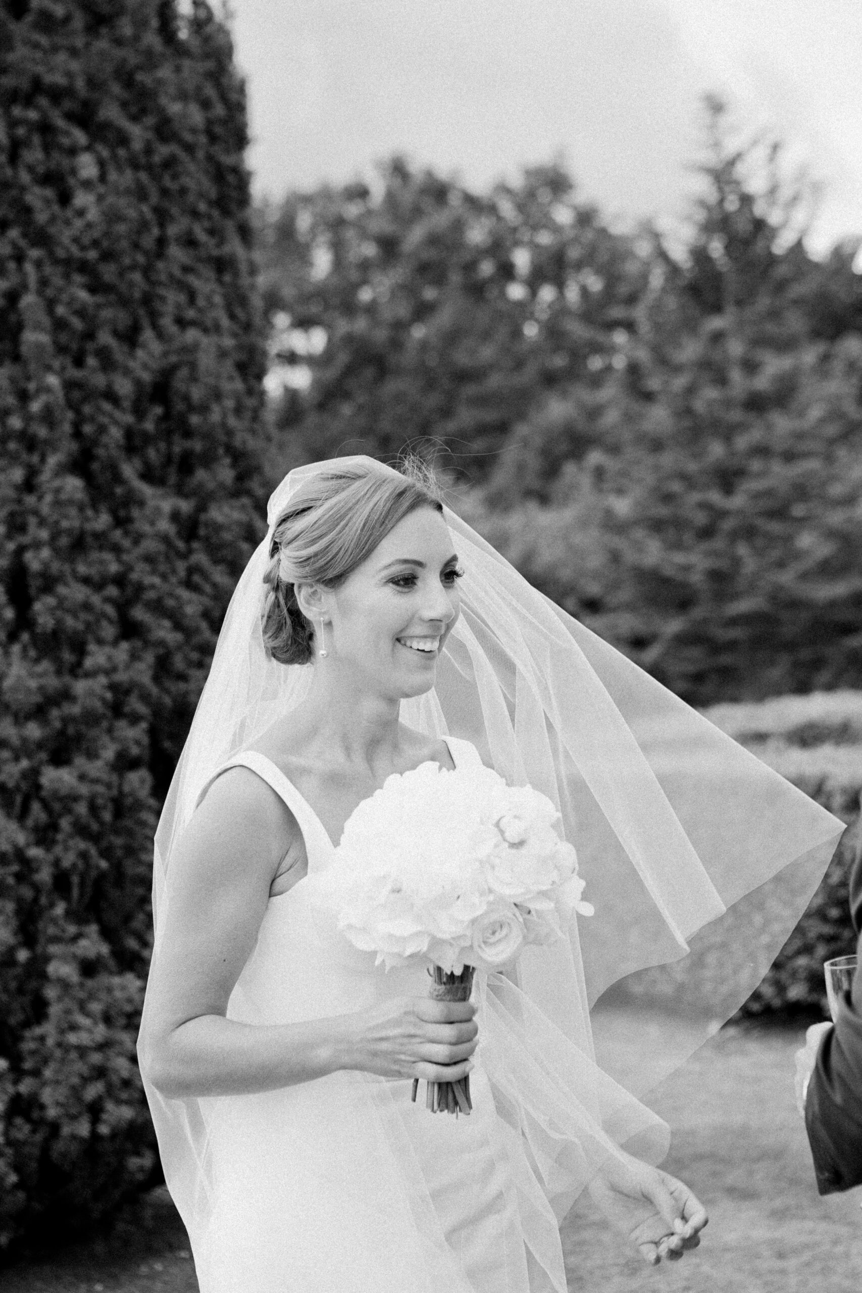 Bride laughs on her wedding day at Hedsor House