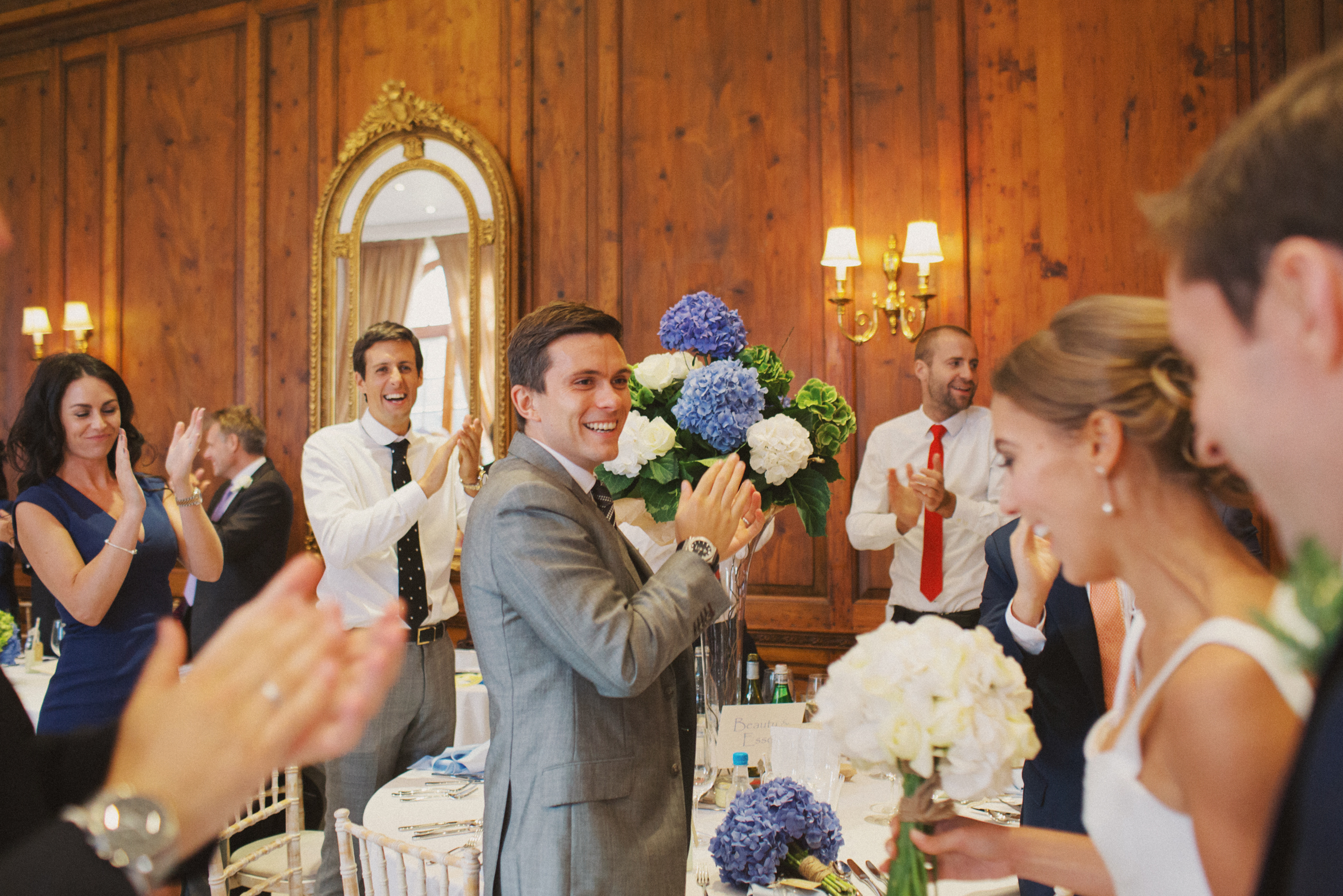 Bride and groom enter the ballroom at Hedsor House on their wedding day