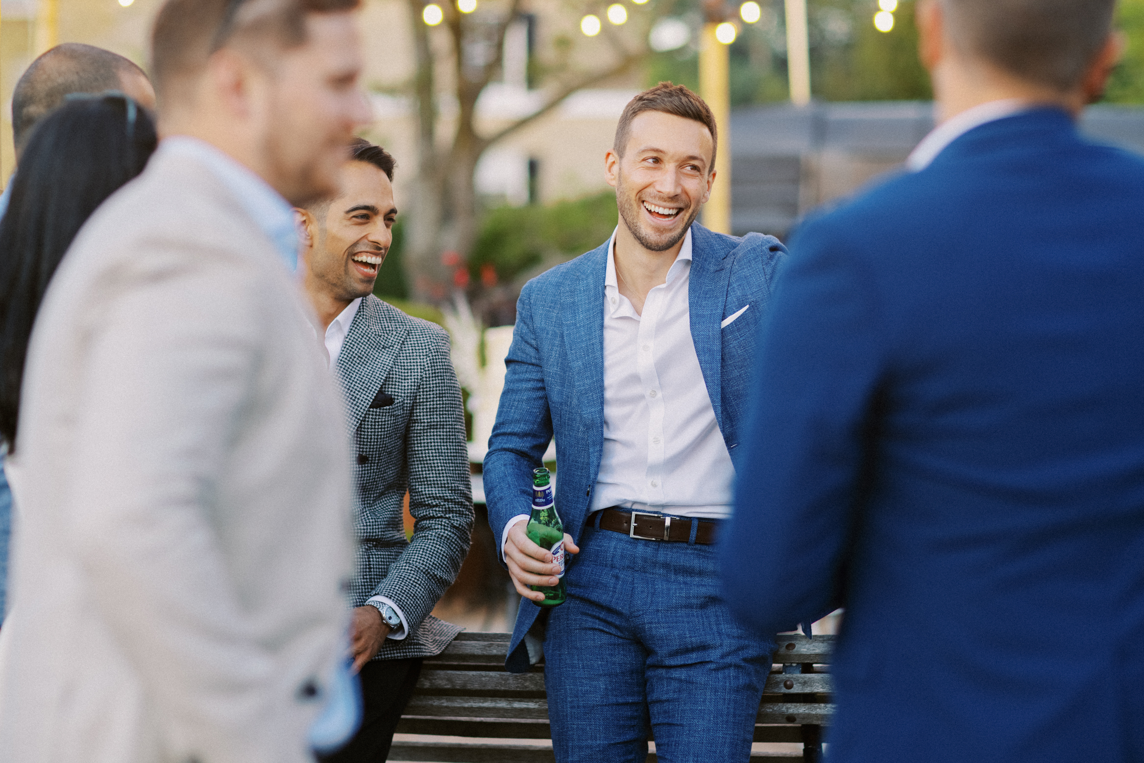 Documentary wedding photography of guests laughing at Preston Court Wedding in Kent