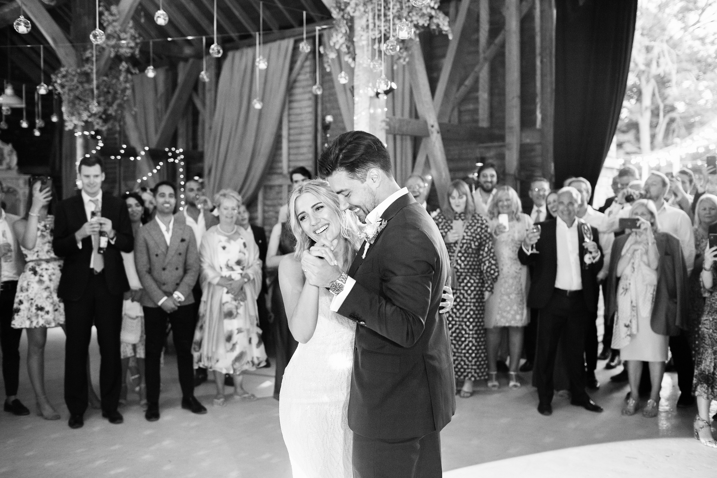 Documentary Wedding Photography of Bride and Groom dancing at their festival themed wedding at Preston Court Wedding venue in Kent