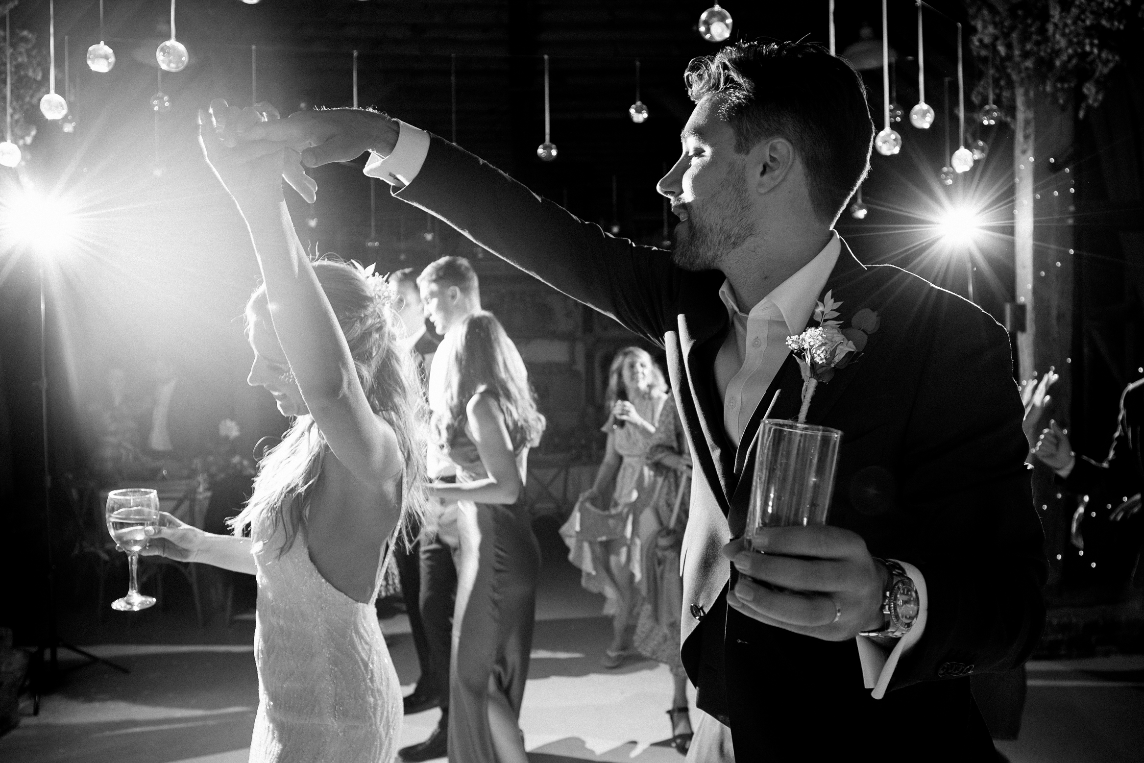 Bride and groom dance at their festival themed wedding at Preston Court Wedding Venue in Kent