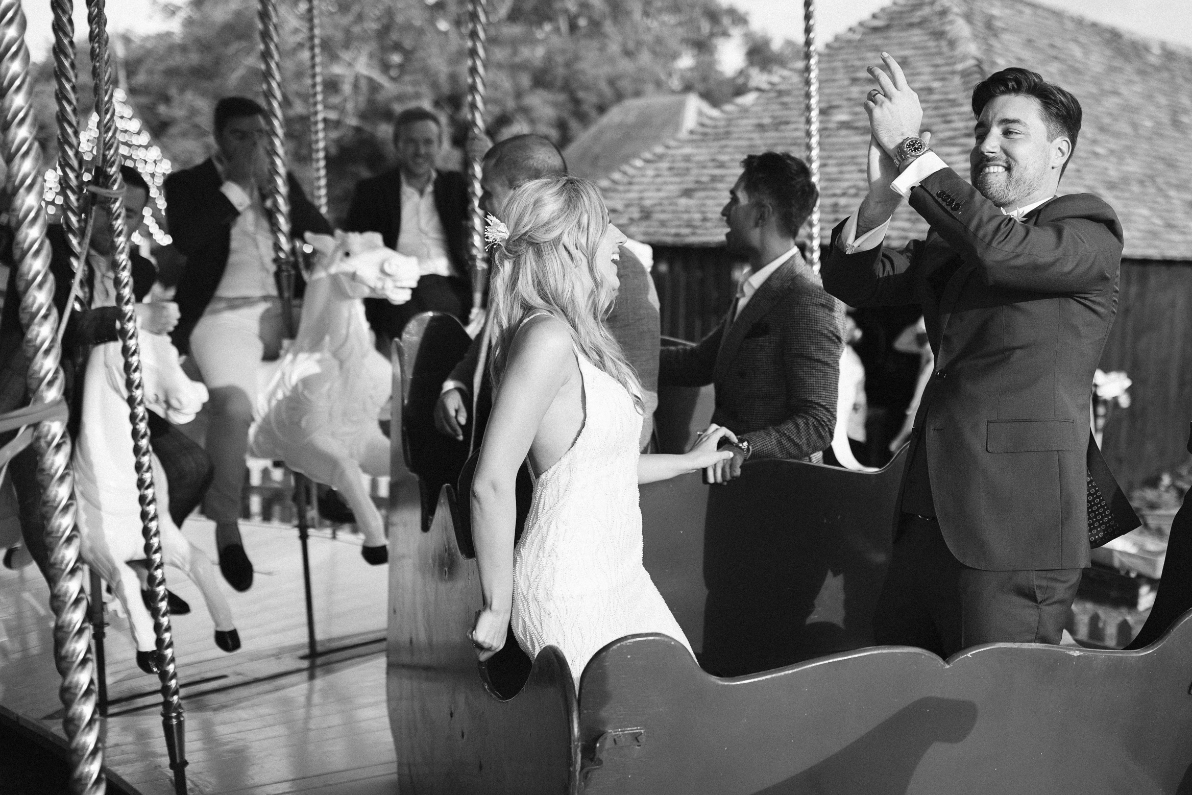 Documentary Wedding photography at Preston Court Wedding Venue in Kent of Bride and Groom on Preston Court's Carousel