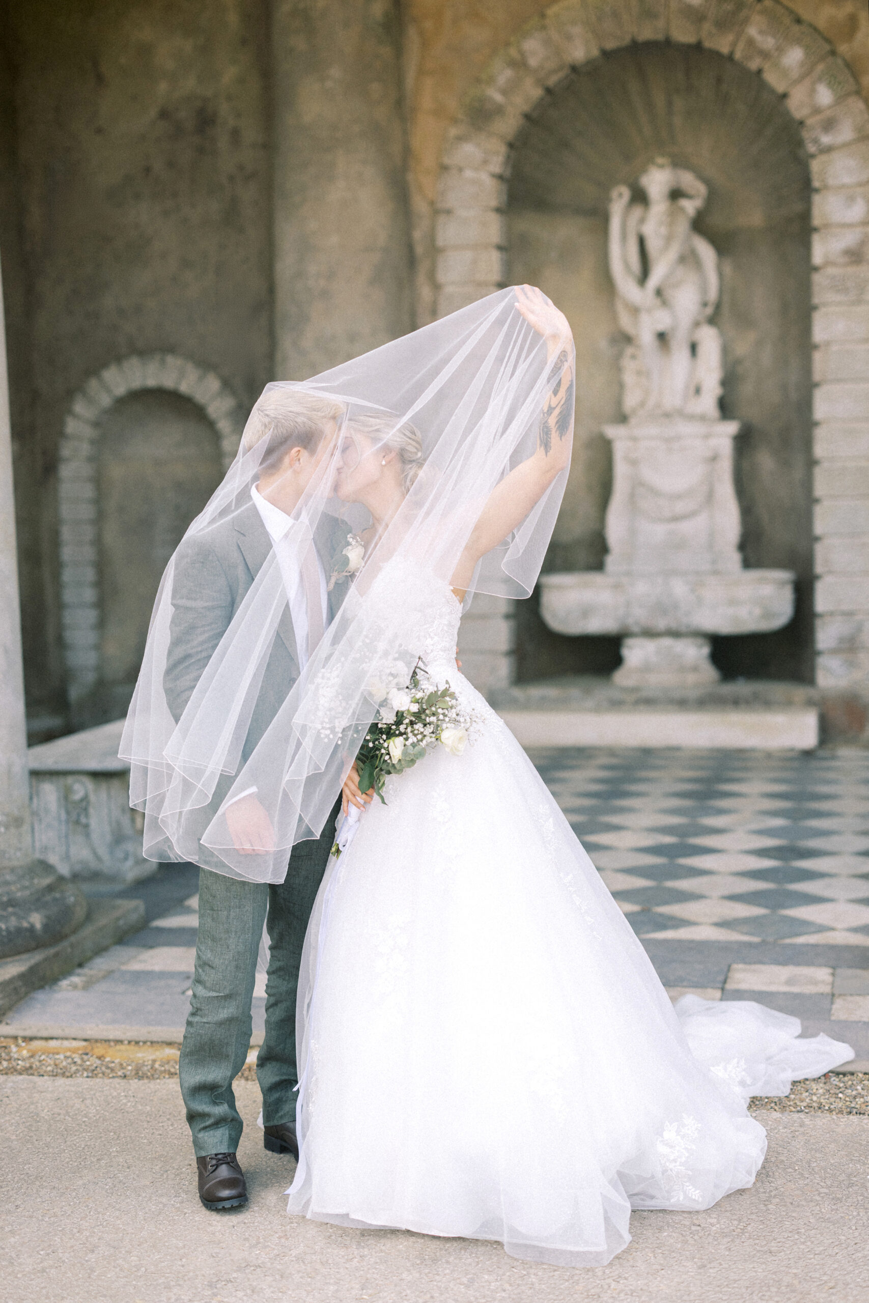 Editorial-style couple portraits with historic Wotton House architecture in the background
