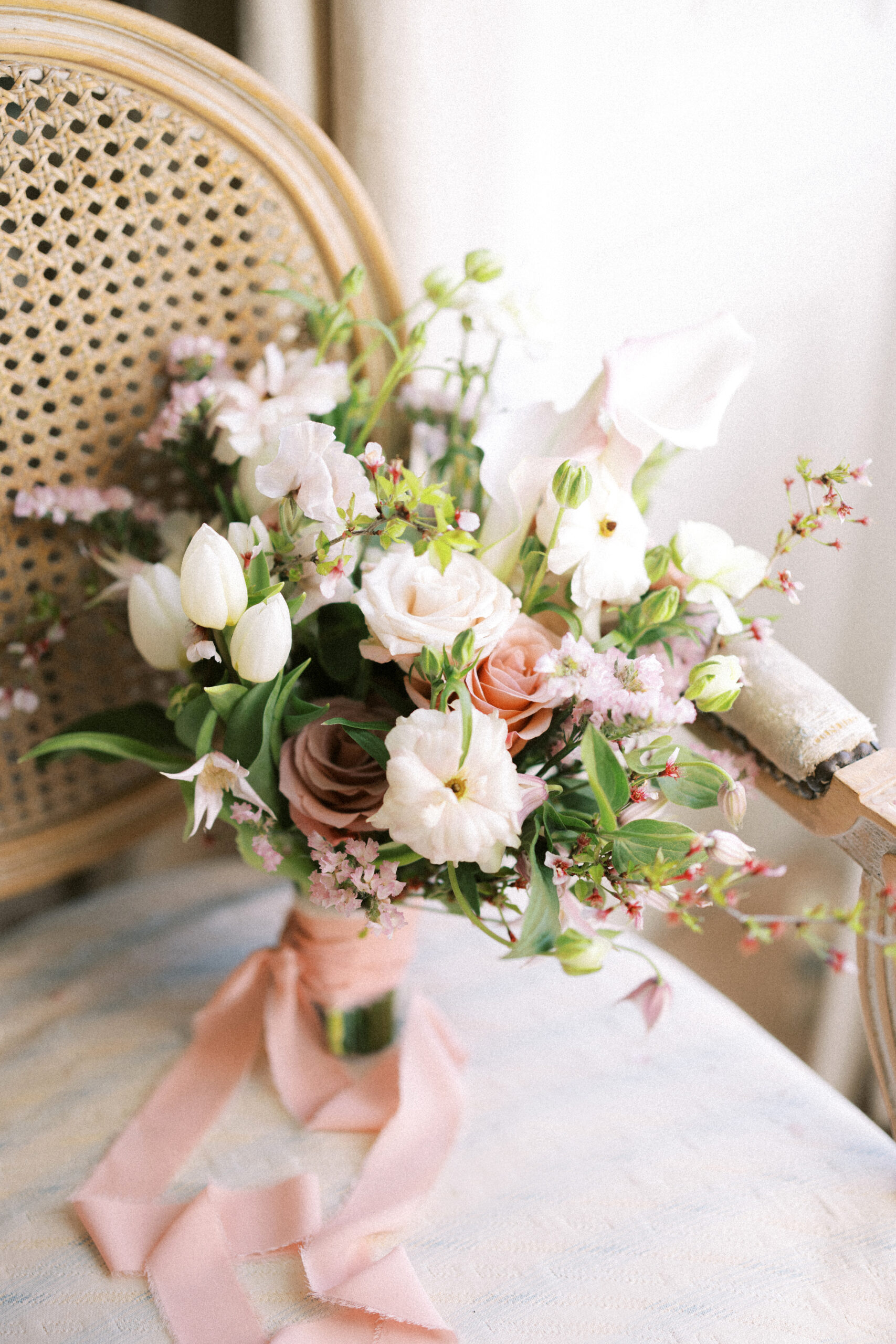 Elegant bridal bouquet with silk ribbons photographed at Findon Place by an editorial wedding photographer