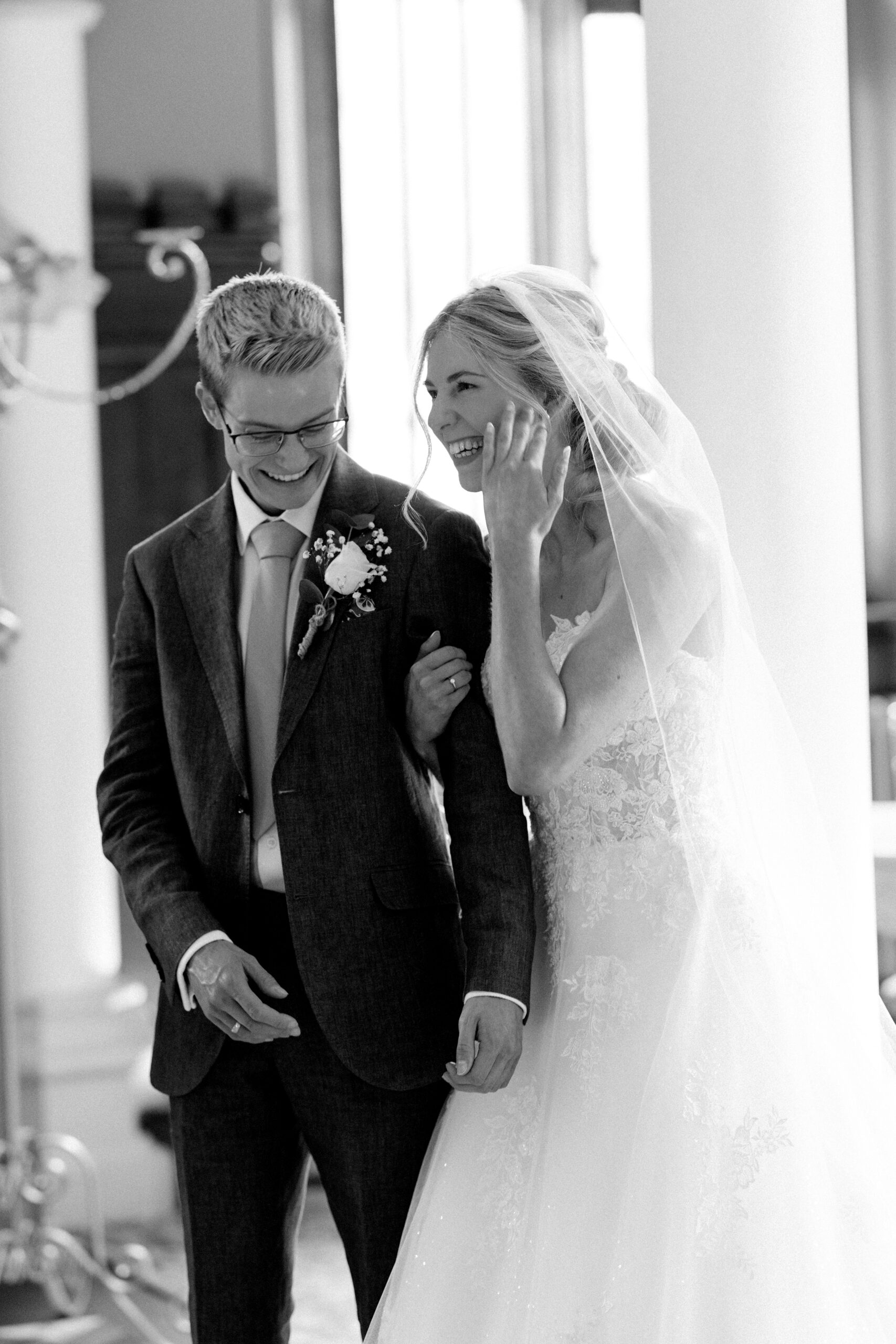 Candid wedding moments captured during the service at Wotton House in Surrey
