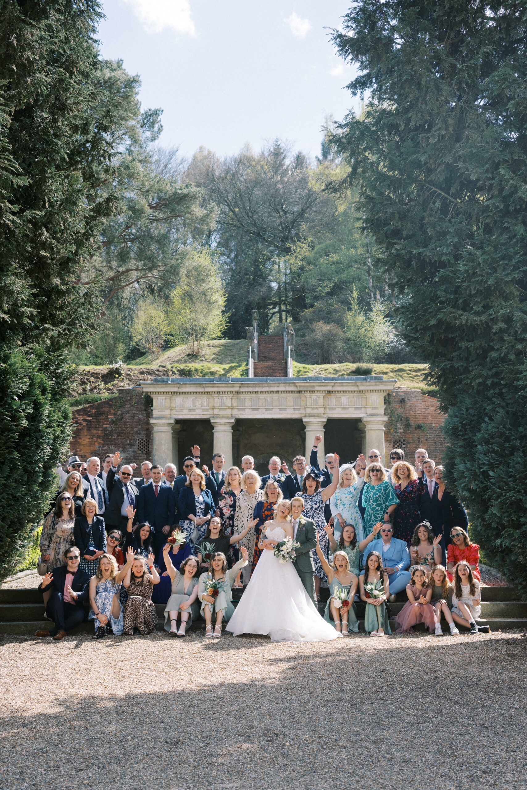 Group wedding photo in the Italian gardens at Wotton House