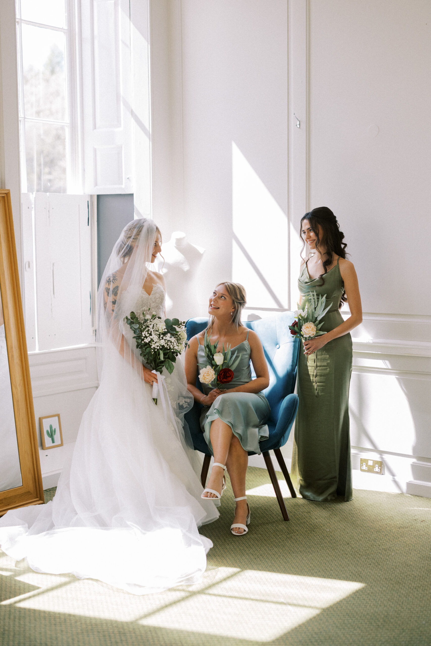 Candid moments of the bride and bridesmaids getting ready at Wotton House
