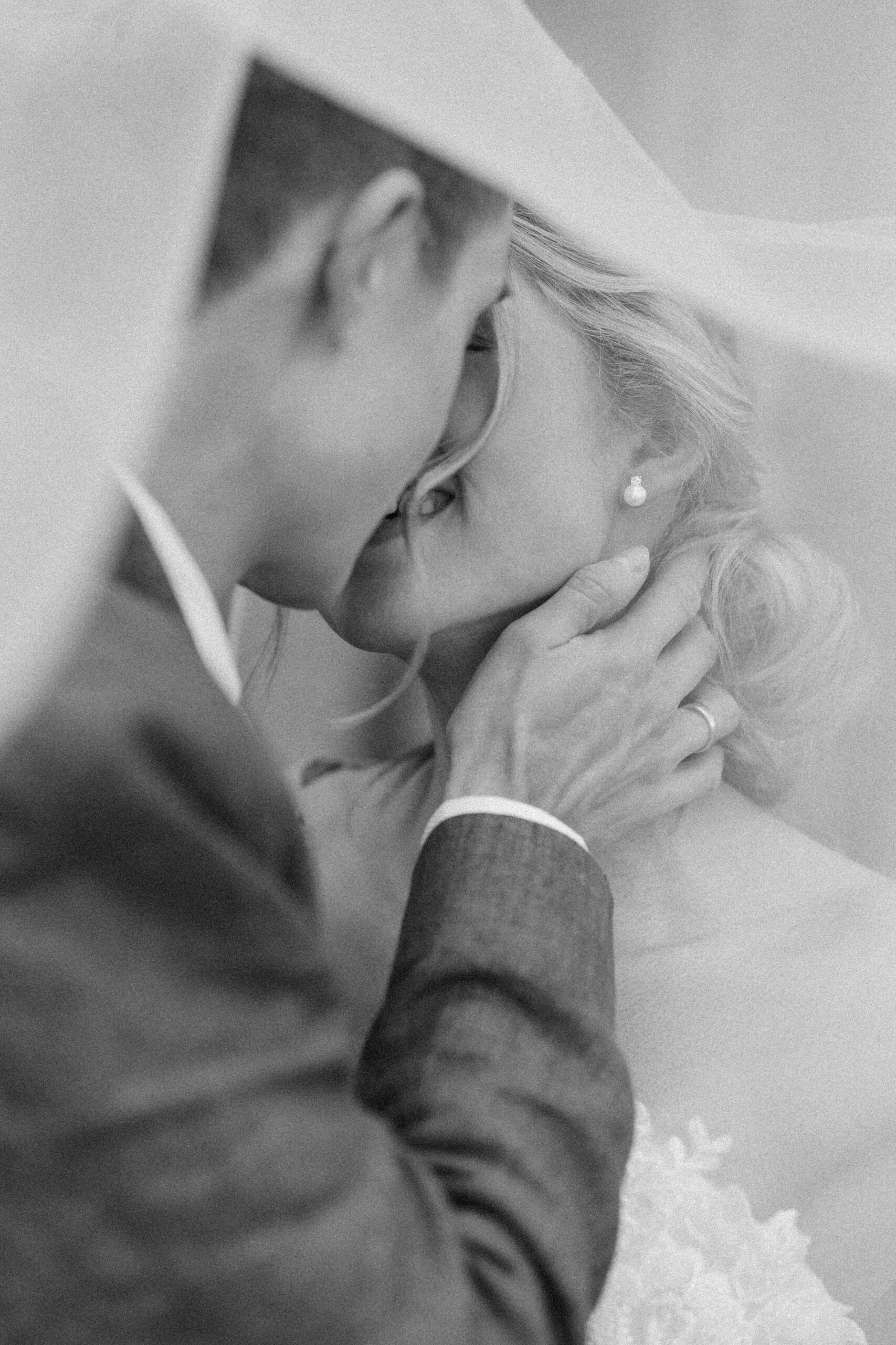 Editorial-style couple portraits around the historic stone architecture of Wotton House