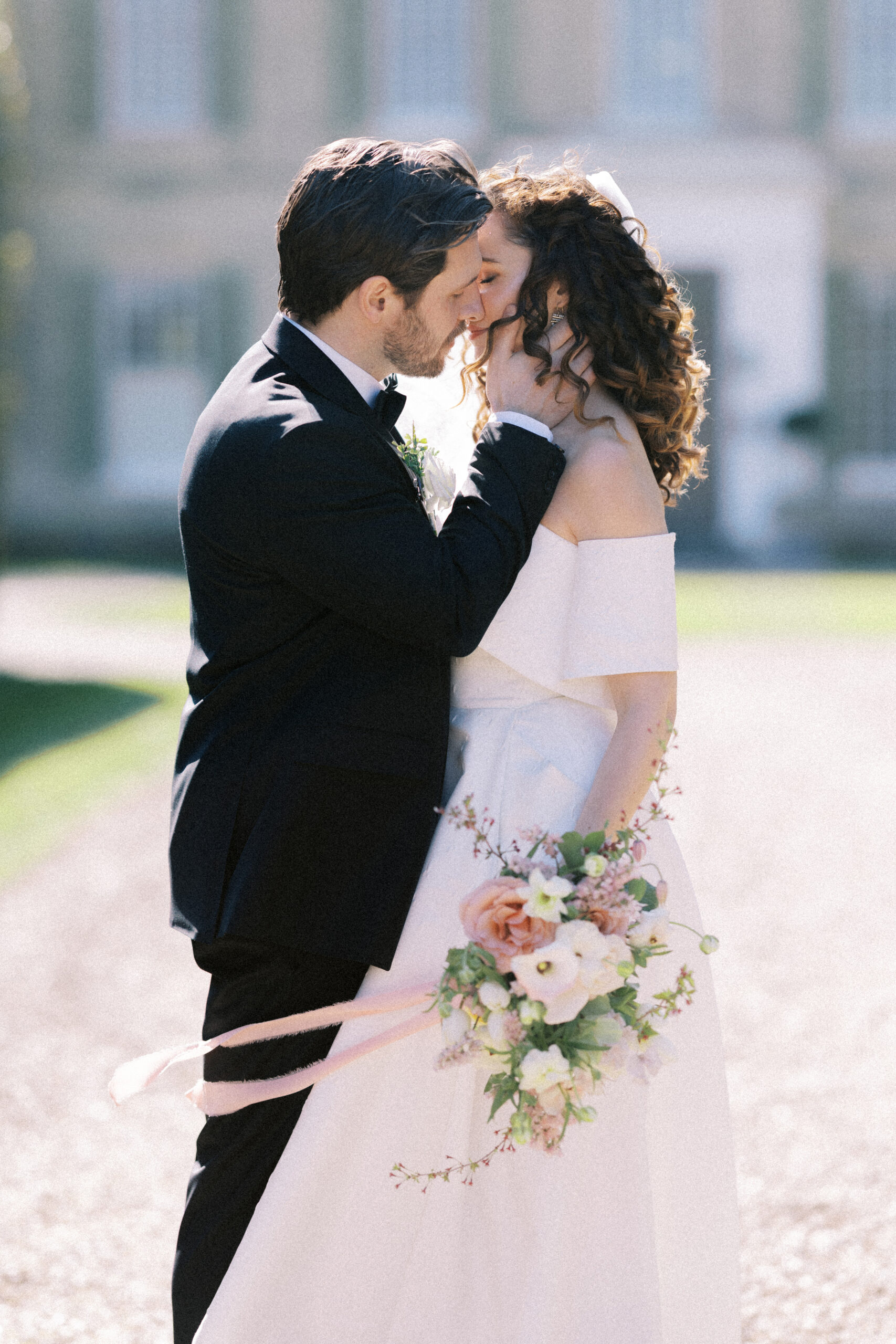 Candid wedding couple walking hand-in-hand around Findon Place estate, captured by an editorial wedding photographer