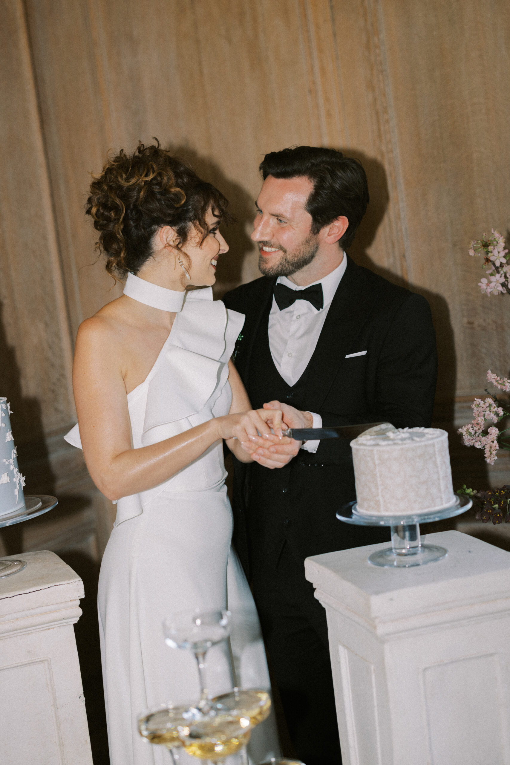 Bride and groom cut the cake at Findon Place Wedding Venue.