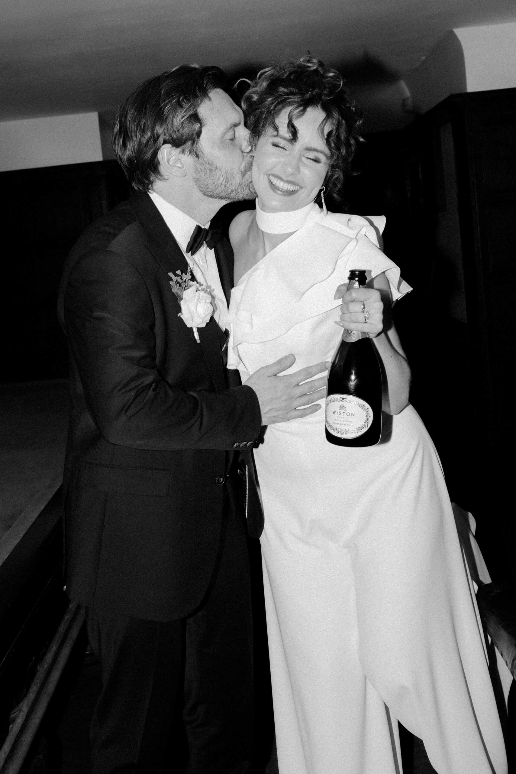Candid couple portrait in low light at Findon Place, photographed by an editorial wedding photographer