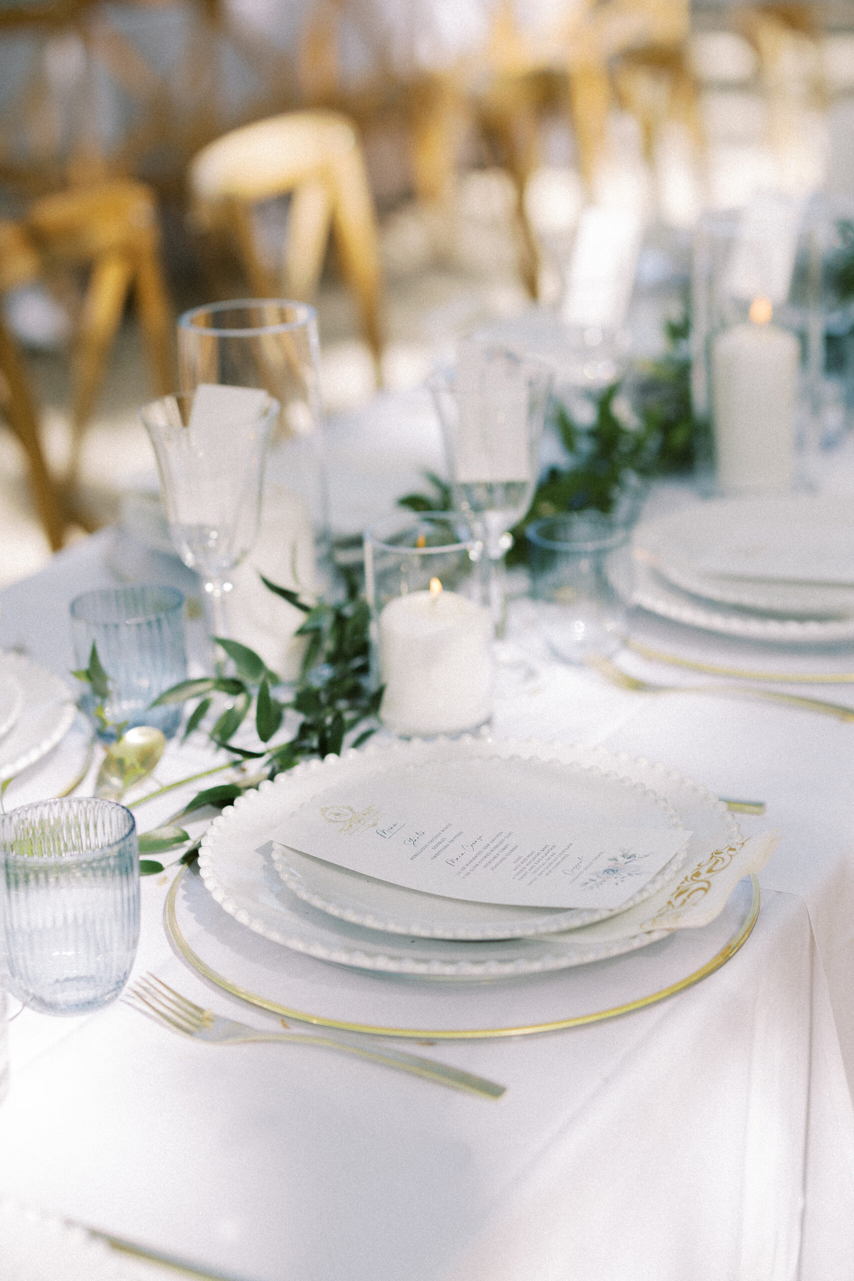 Magical evening wedding reception at Château de Valmousse, Provence, featuring long tables illuminated by fairy lights.