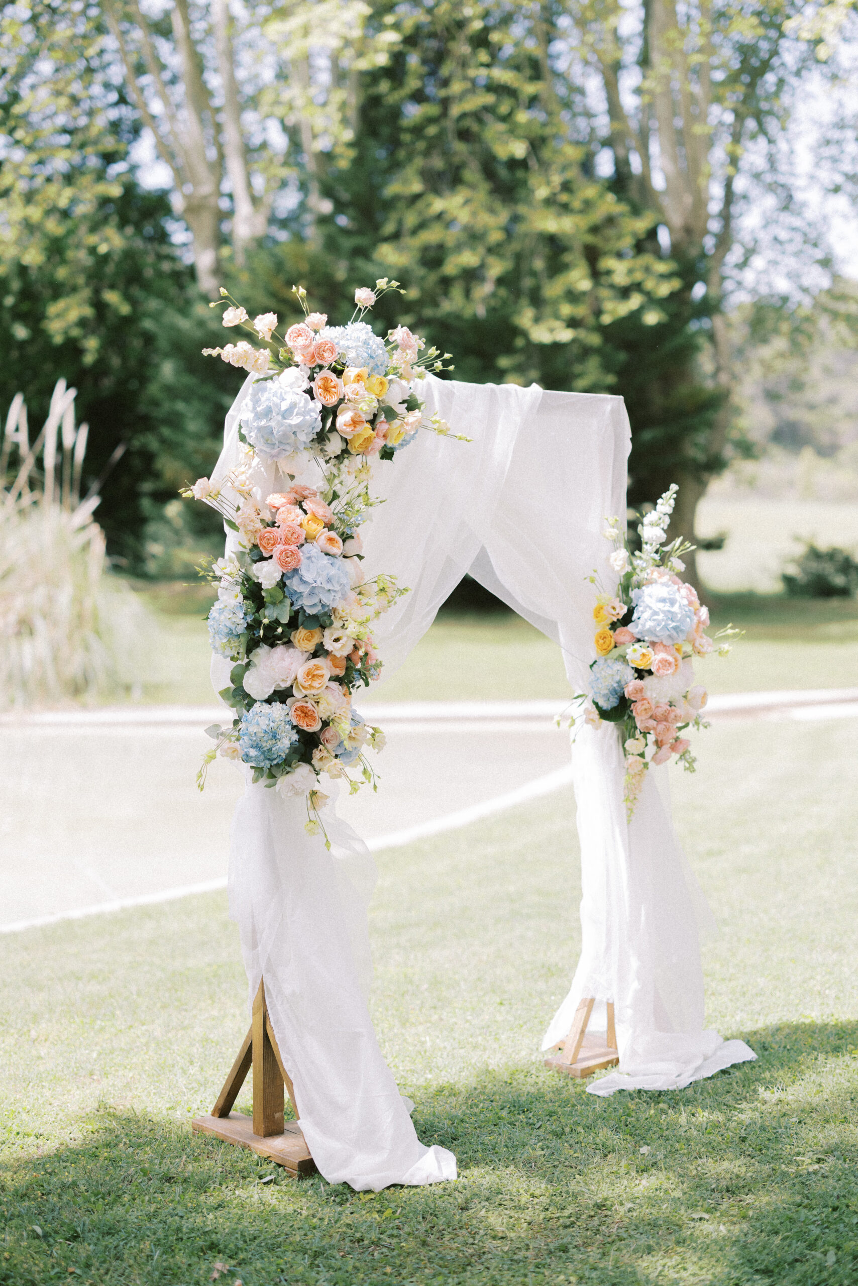 Floral arch set up for a destination wedding ceremony in France