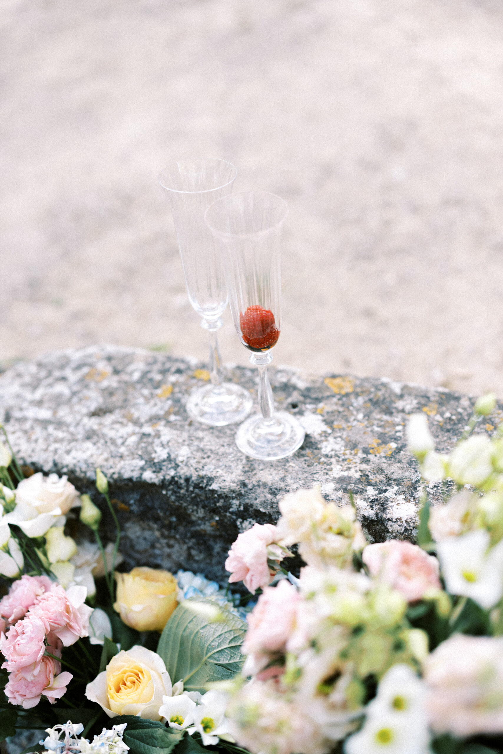 Strawberry in a champagne glass left over on a wedding day in France