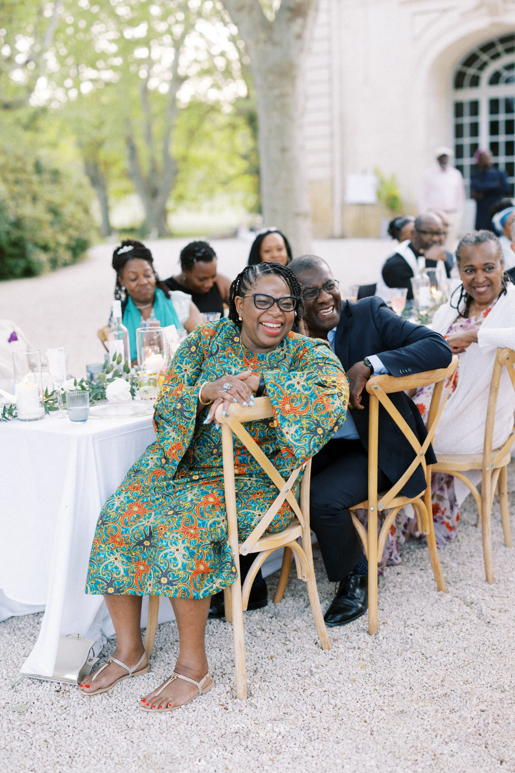 Candid reactions from guests during speeches at a luxury destination wedding in France