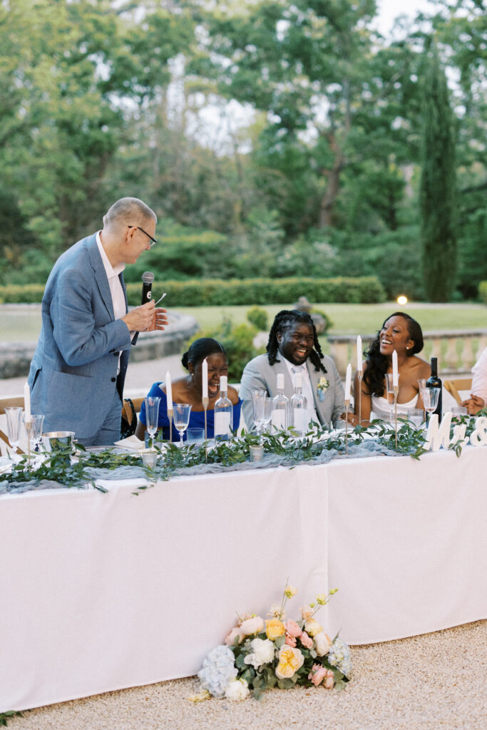 Bride and Groom listening to a touching toast at a luxury destination wedding in Provence