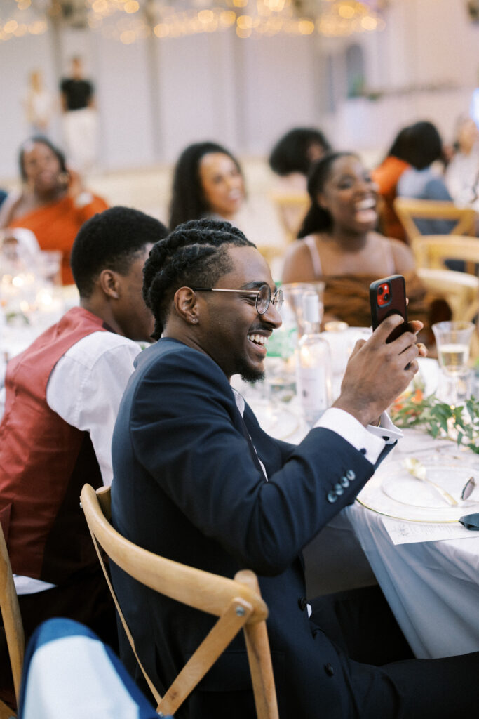 Candid reactions from guests during speeches at a luxury destination wedding in France