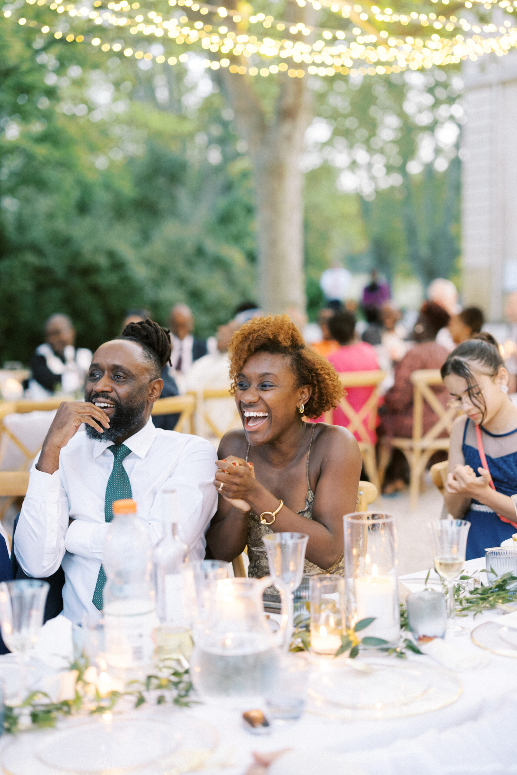 Guests react to wedding speeches at destination wedding in France