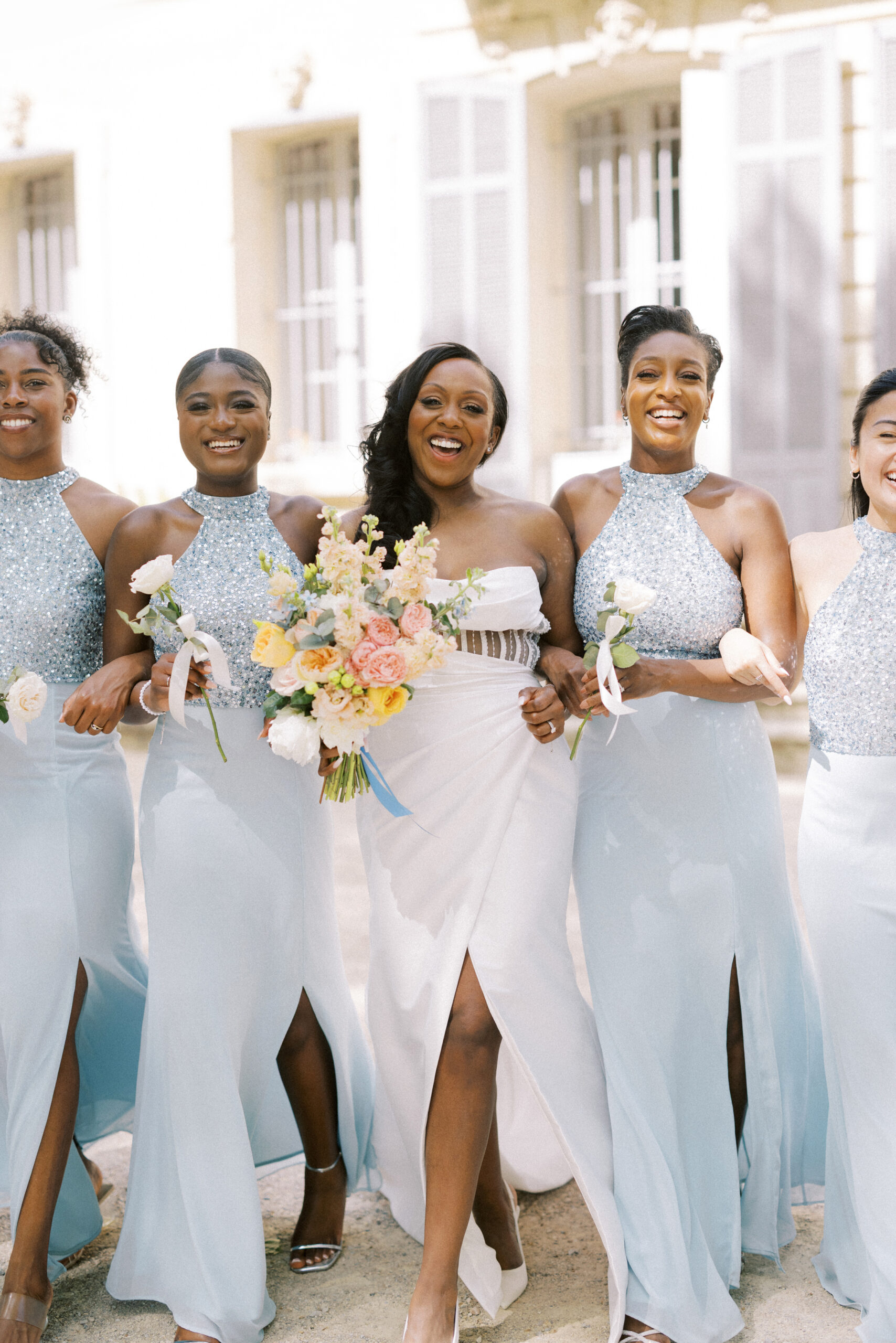 Bridesmaids walking together at a luxury destination wedding in Provence