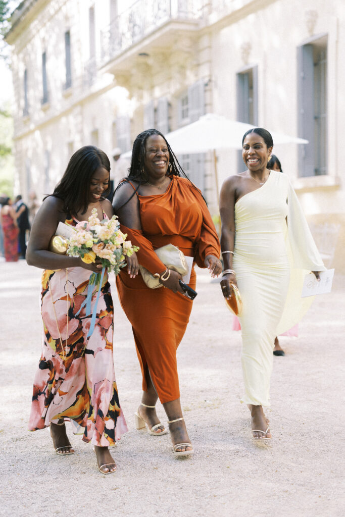 Guests walk the grounds of Chateau de Valmousse on wedding day