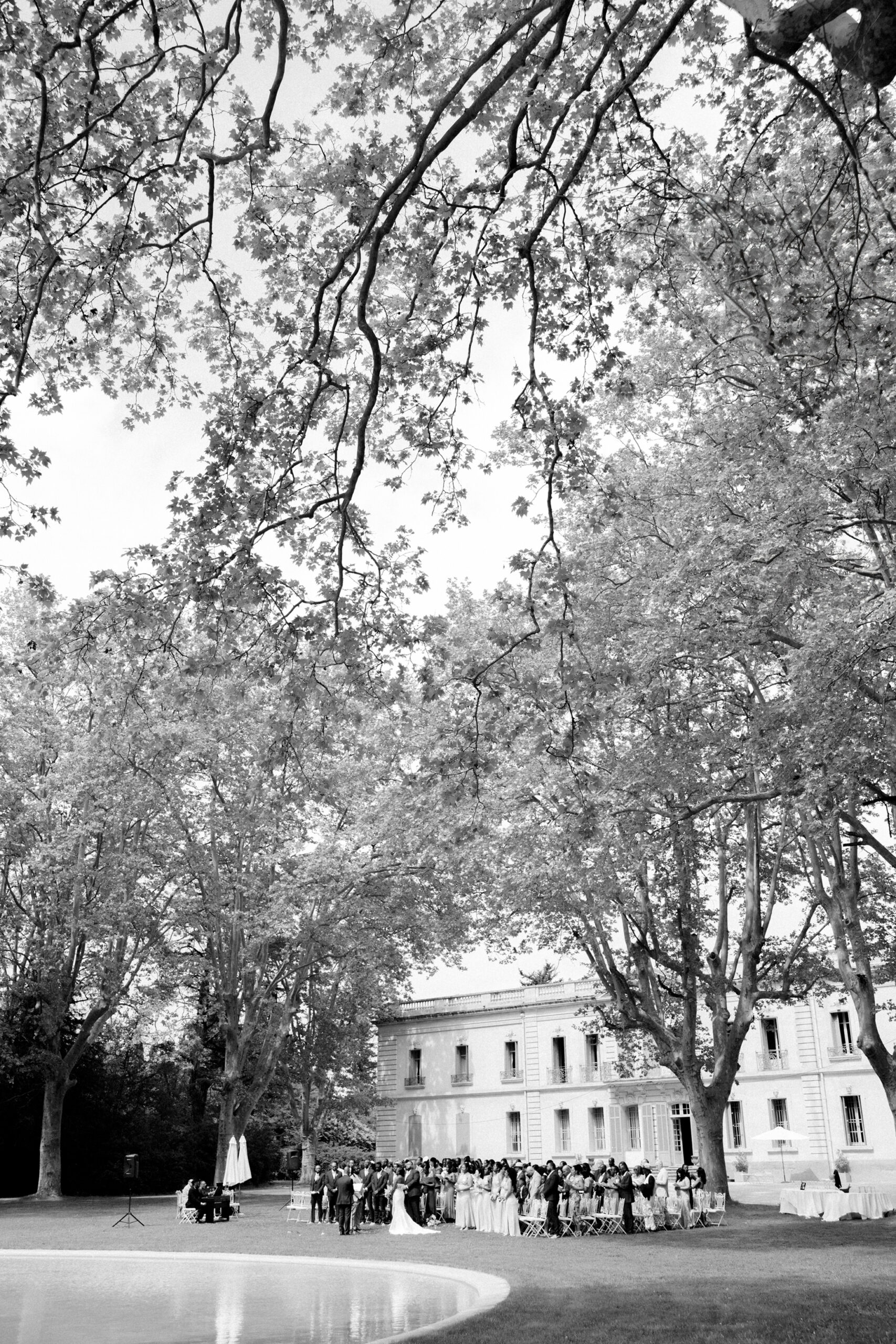 Outdoor wedding ceremony in France with Chateau de Valmousse in the background