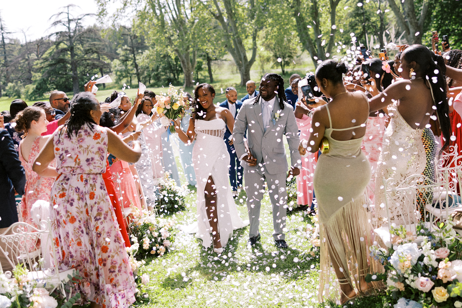 Bride and groom walk down the aisle at Chateau de Valmousse by a French destination wedding photographer