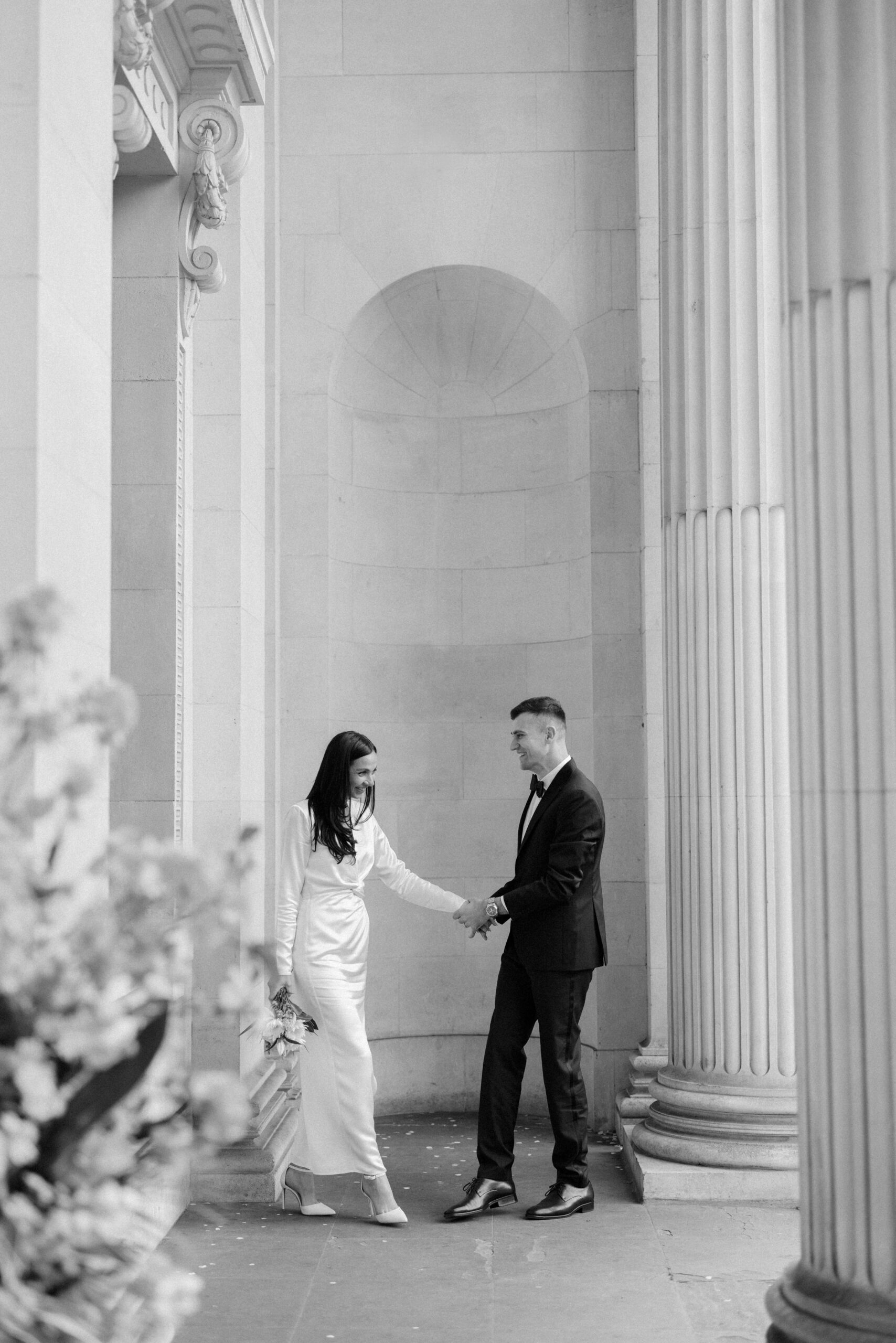 Bride and groom portraits outside Old Marylebone Town Hall in London