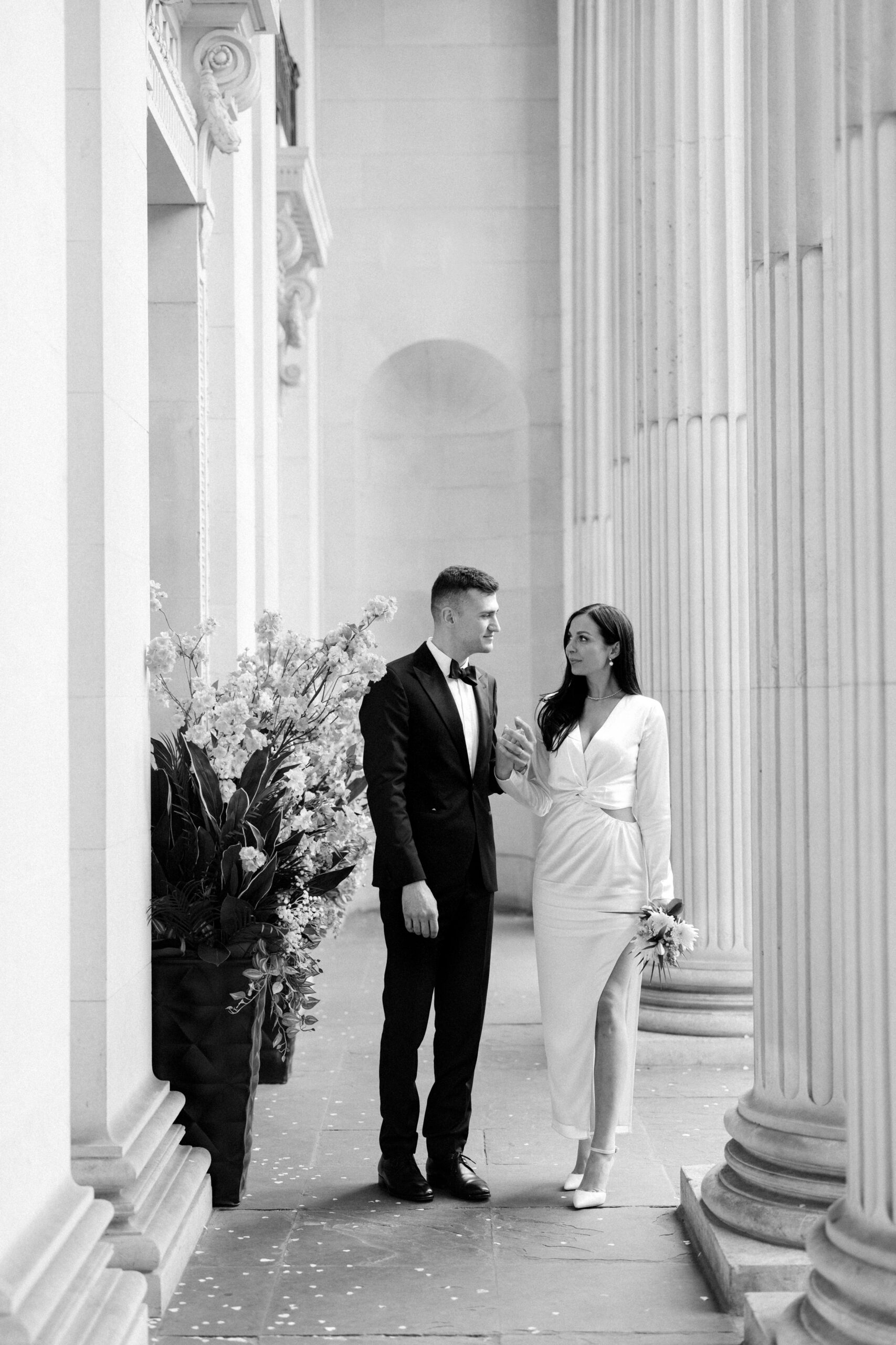Editorial style wedding photography of couple on the steps at Old Marylebone Town Hall in London