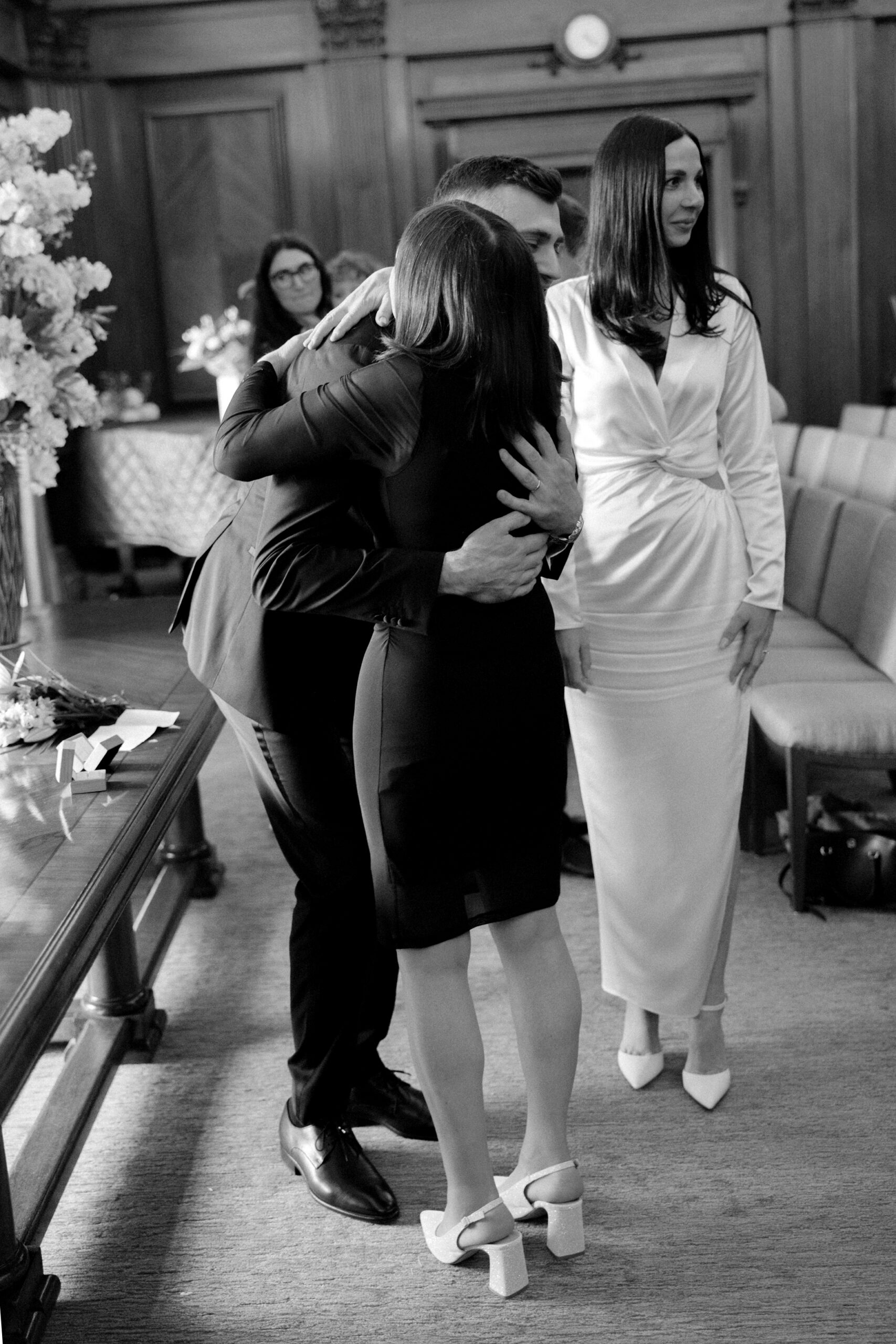 Groom embraces his mum after marrying at London registry office wedding
