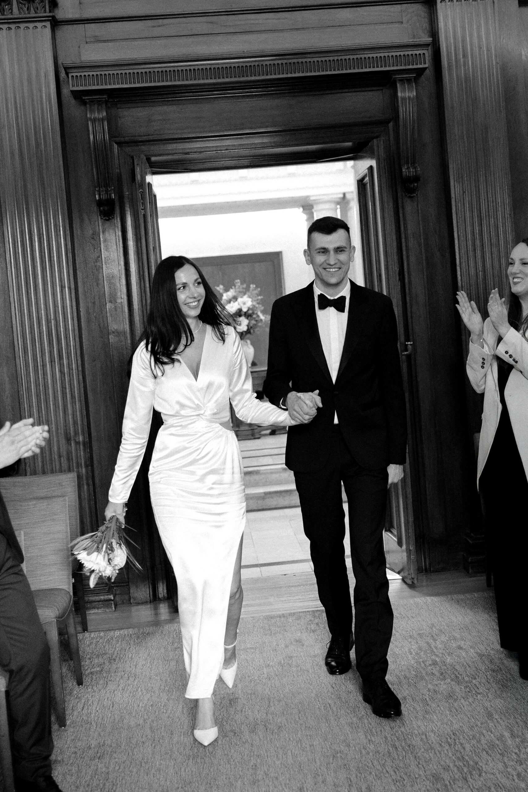 Couple enter the legal ceremony room at Old Marylebone Town Hall