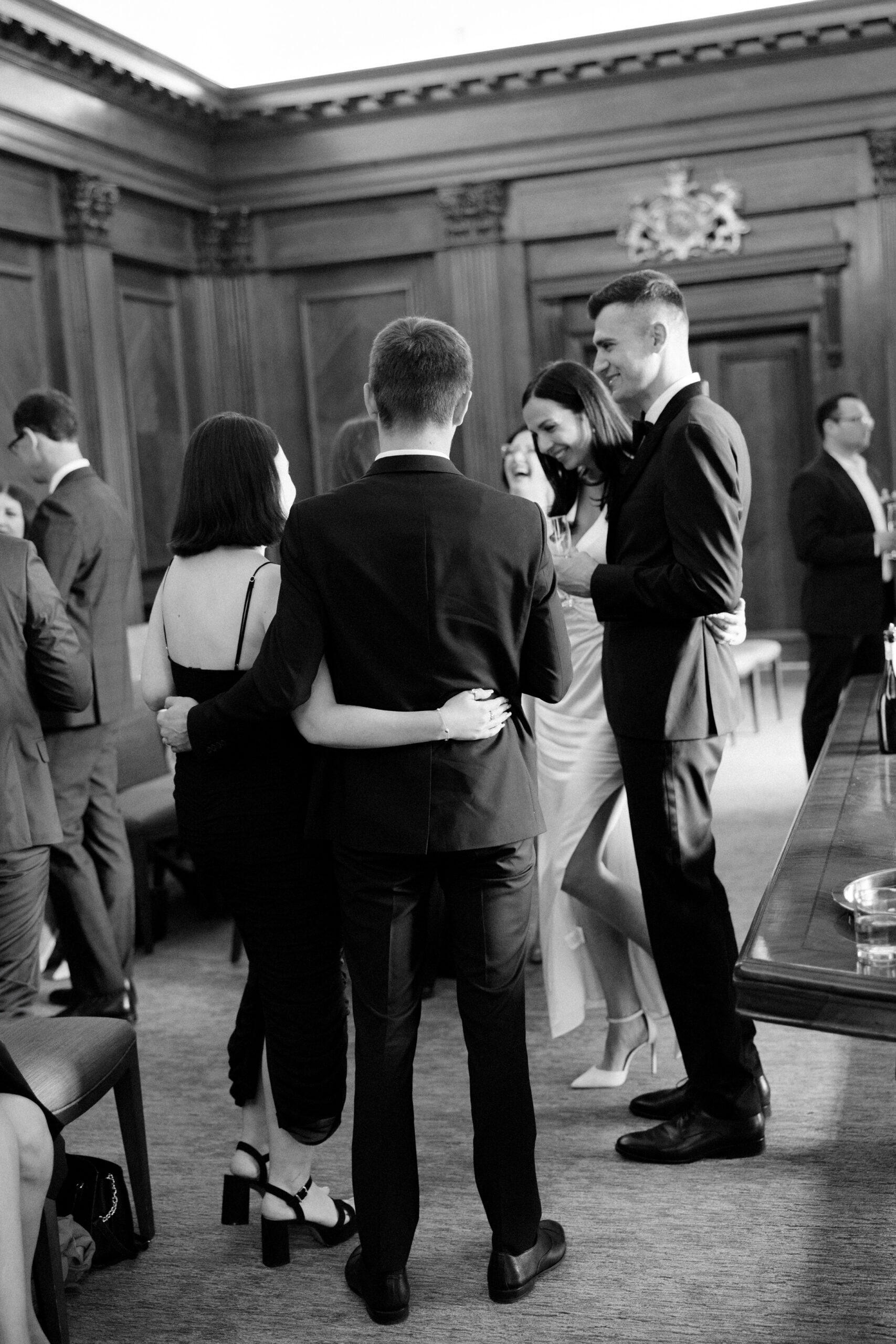 Guests mingle a intimate civil wedding ceremony at Old Marylebone Town Hall in London