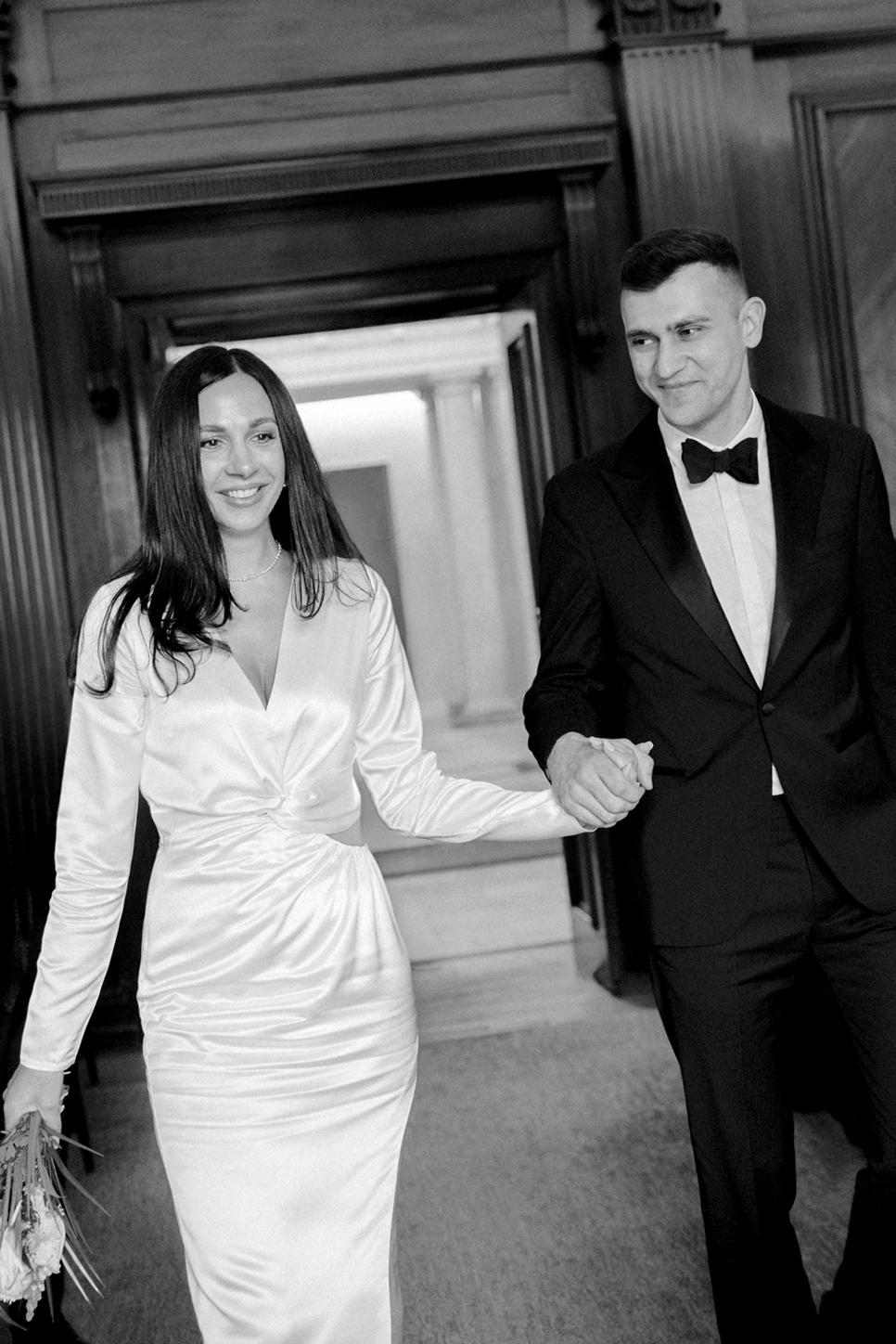 Bride and groom walk down the aisle during civil ceremony at Old Marylebone Town Hall in London