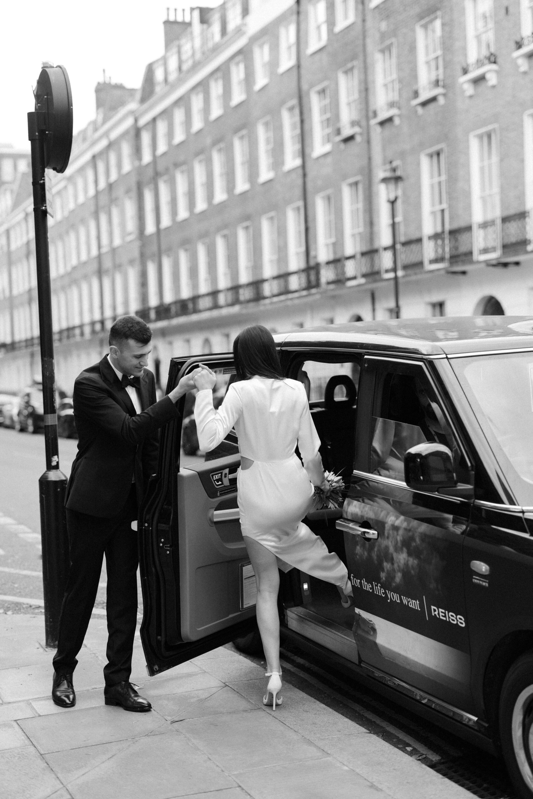 London Black Cab photography of wedding couple in London