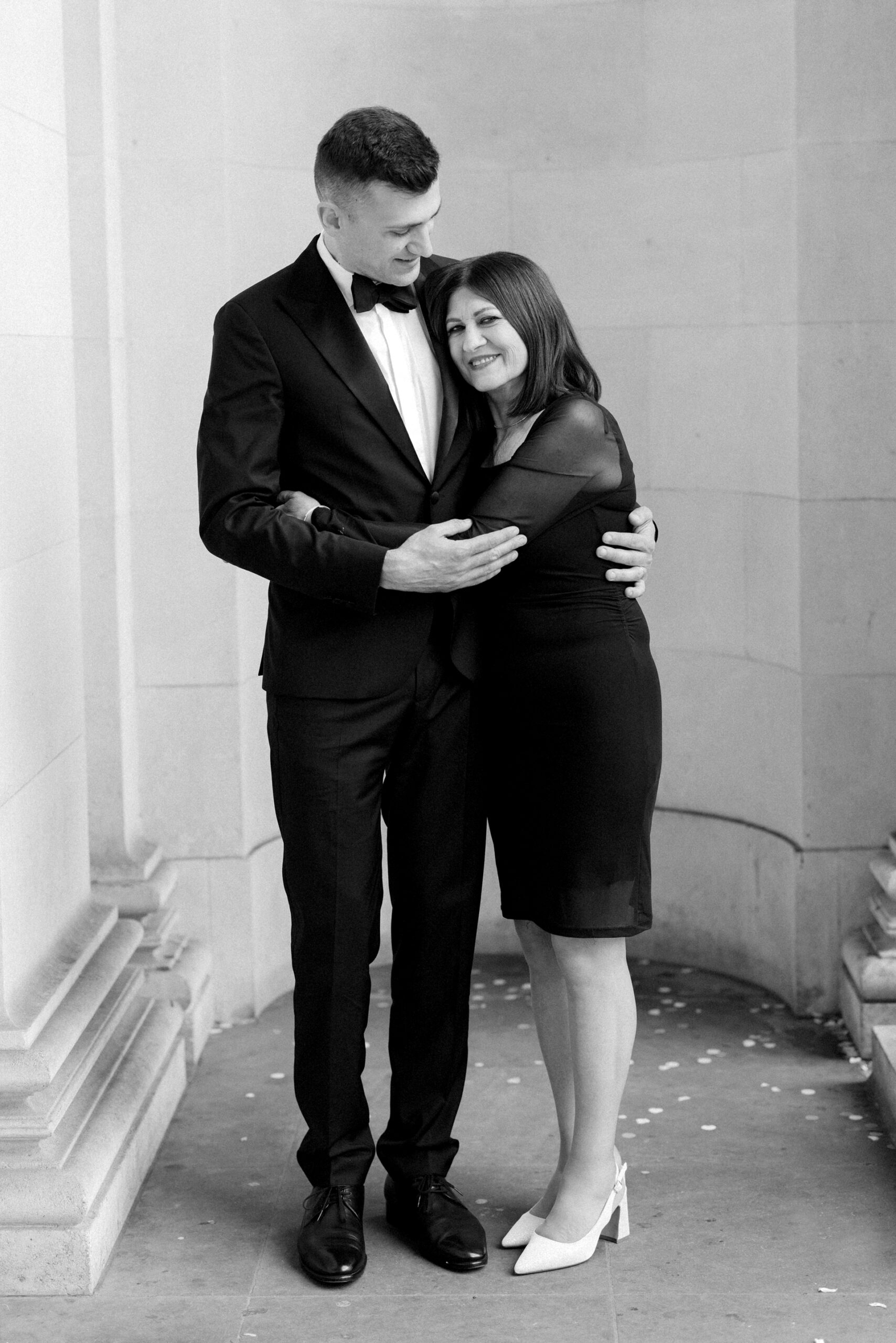 Groom his mum for a candid style wedding photograph at Old Marylebone Town Hall